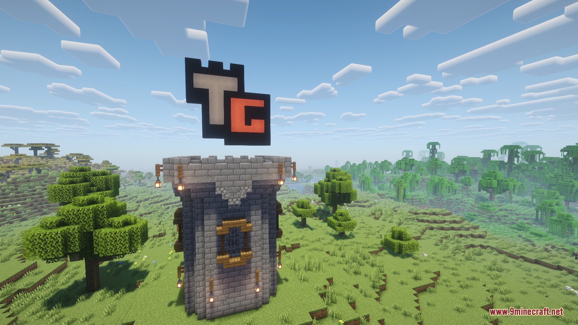 Tower Game Mod Screenshot 2 A stone tower with a floating TG logo in a green landscape