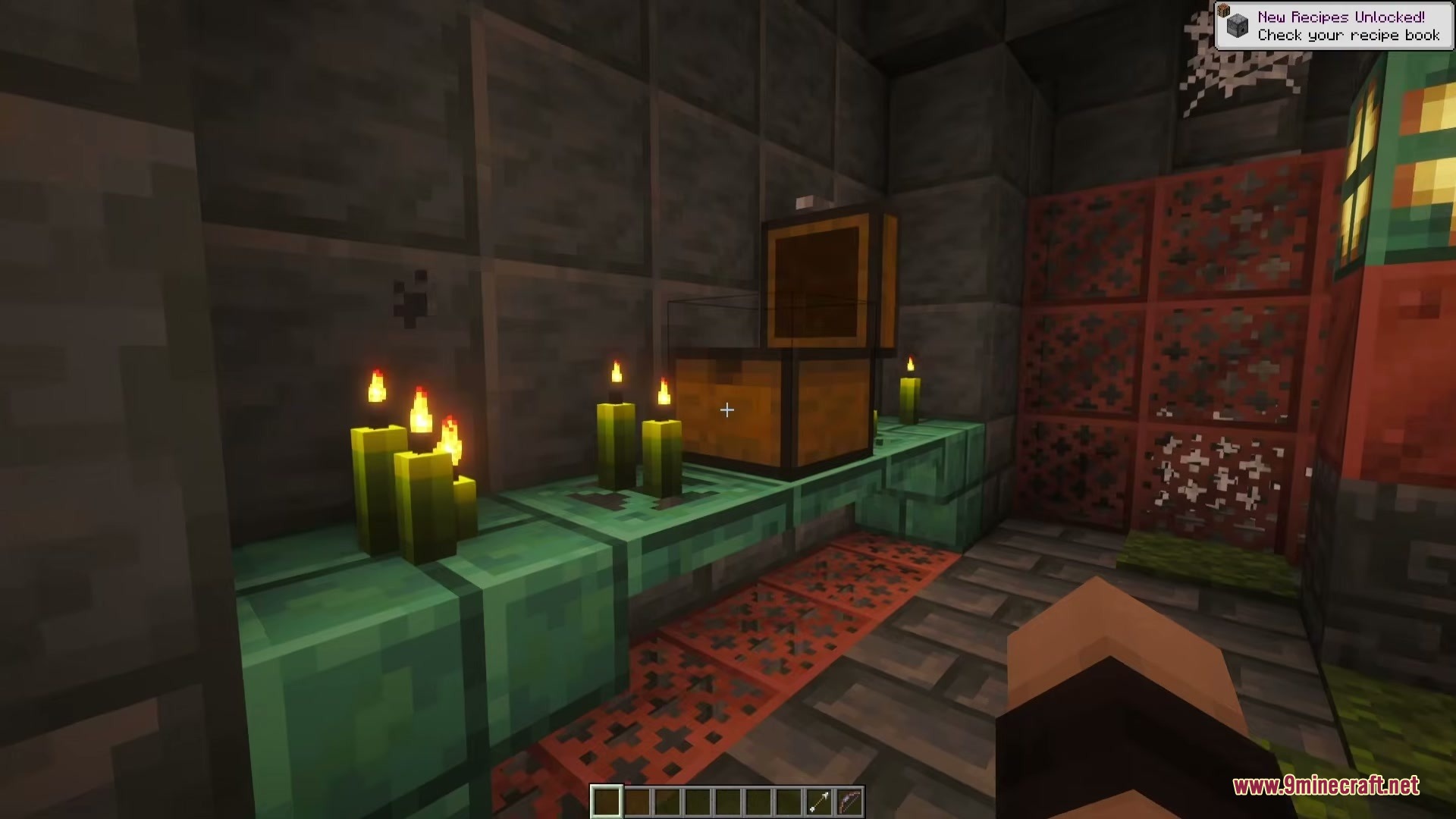 Towers of Chambers Mod Screenshot 4 An open loot chest sitting on a copper shelf beside lit green candles