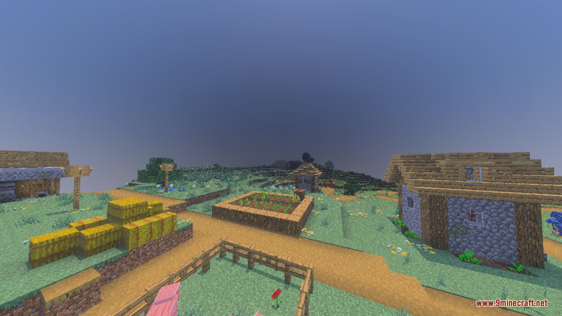 A peaceful Minecraft village with hay bales and thick atmospheric fog