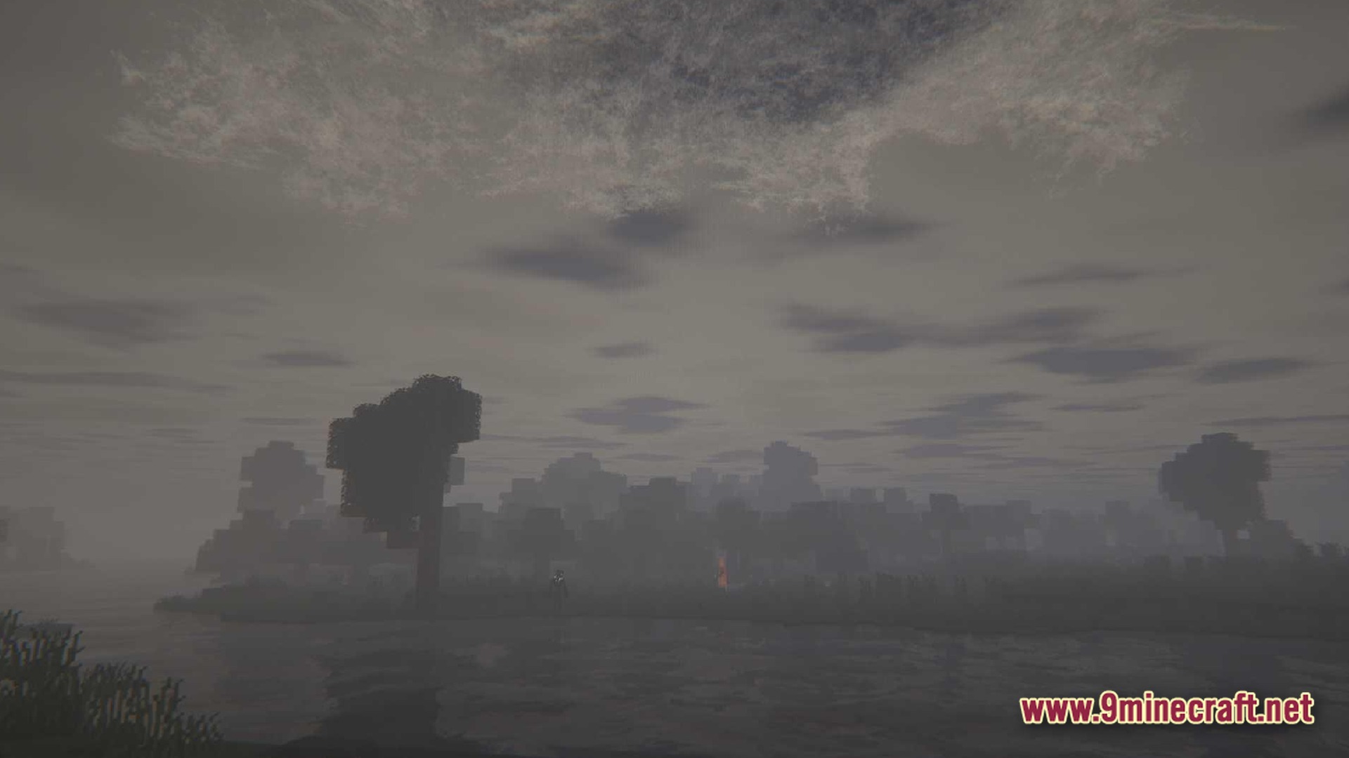 True Horror Modpack Screenshot 10 A dark, foggy Minecraft landscape featuring a distant forest, a body of water, and overcast skies