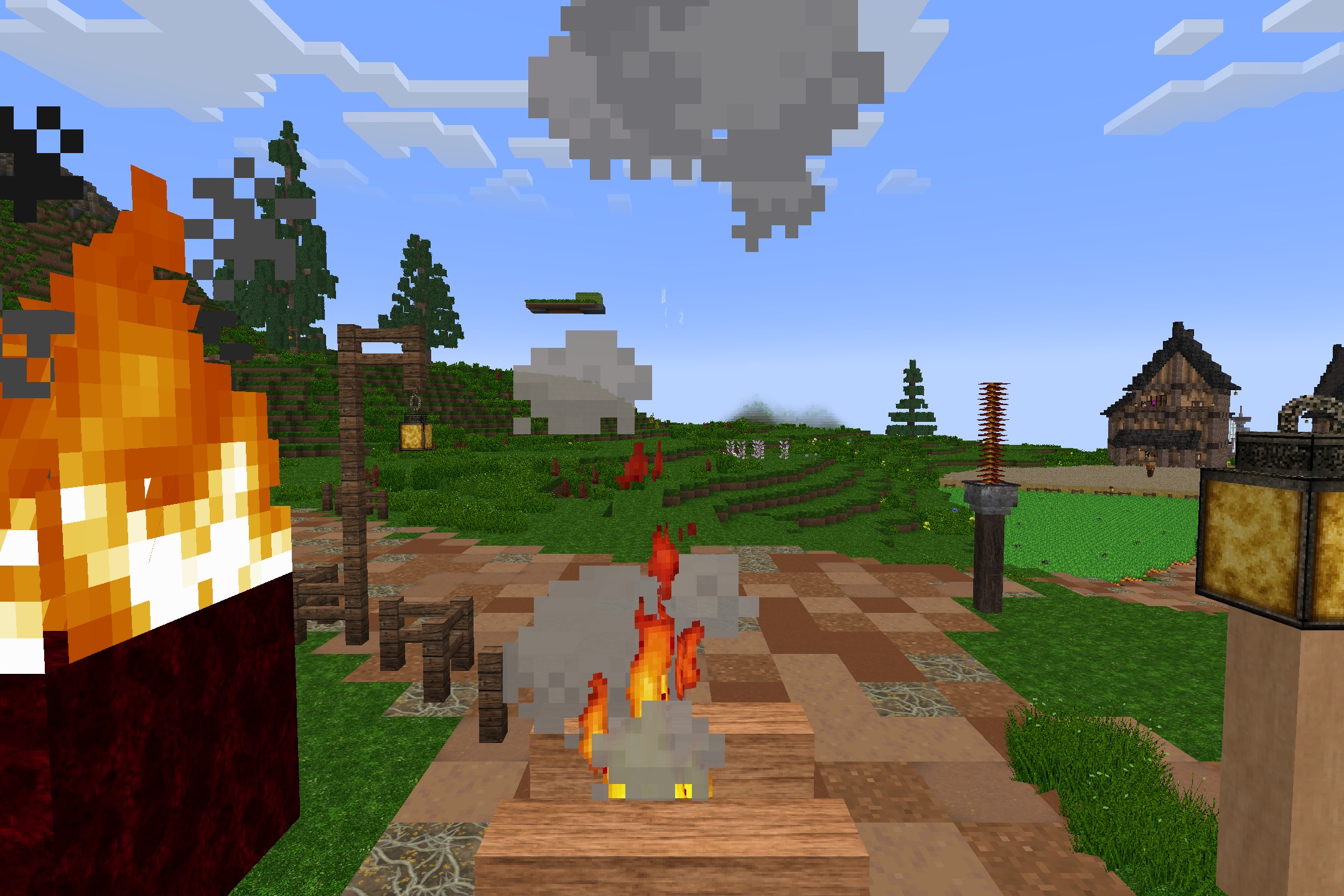 Detailed textures on a campfire and lantern post near a wooden village house