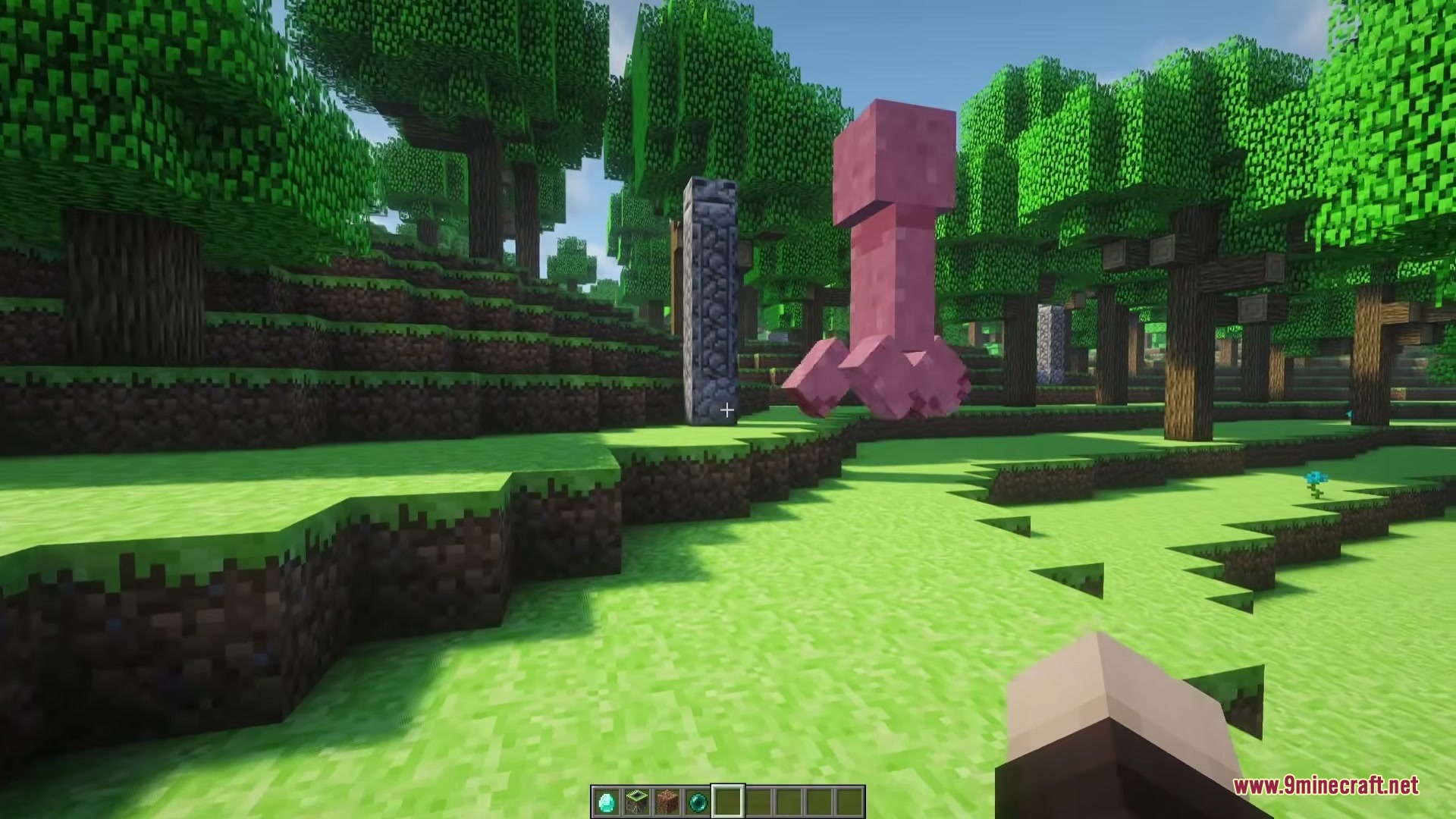 A strange pink creeper variant roaming through a green forest in Minecraft