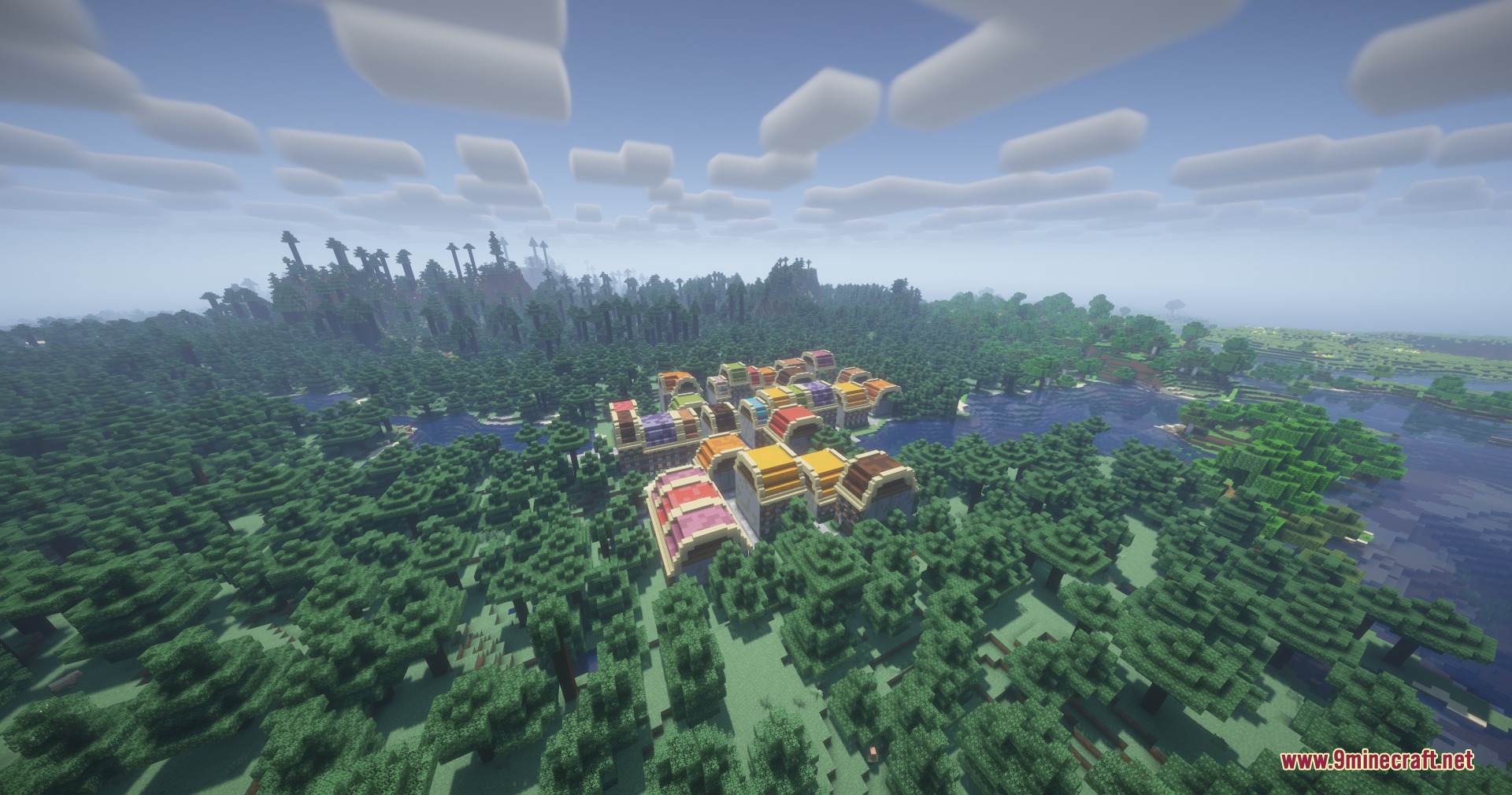 Aerial view of a custom city with vibrant rooftops nestled in a forest
