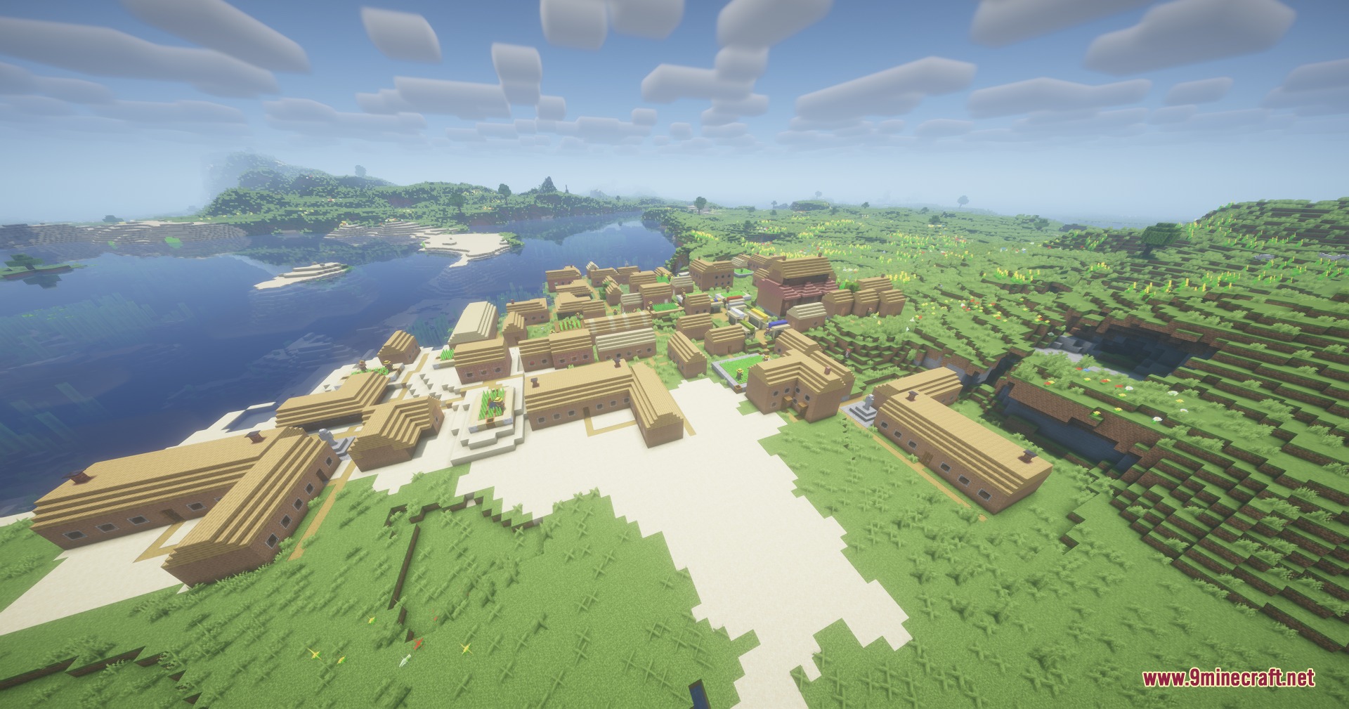 Aerial view of a large coastal town featuring dense architecture and wooden houses