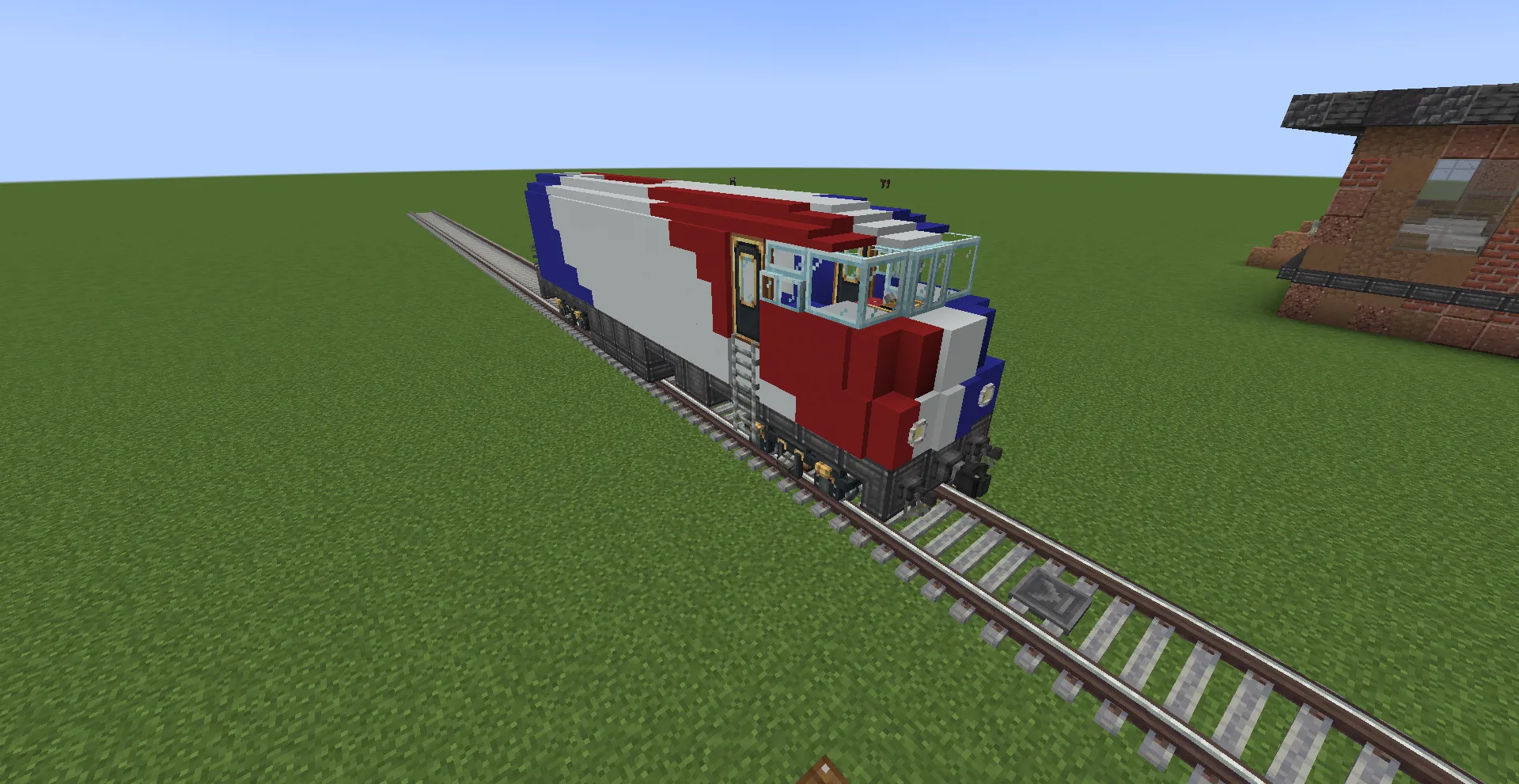 Isometric view of the red white and blue locomotive on a train track