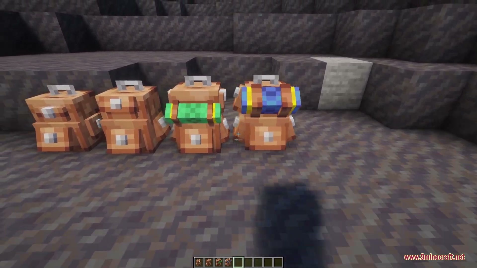 Vagabond Cargo Mod Screenshot 3 Four tiers of backpacks from Vagabond Cargo Mod placed on the ground