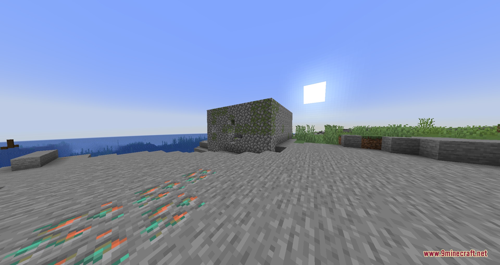 Vanguard of the Abyss Mod Screenshot 2 A mossy cobblestone structure sits on a rocky beach near the ocean