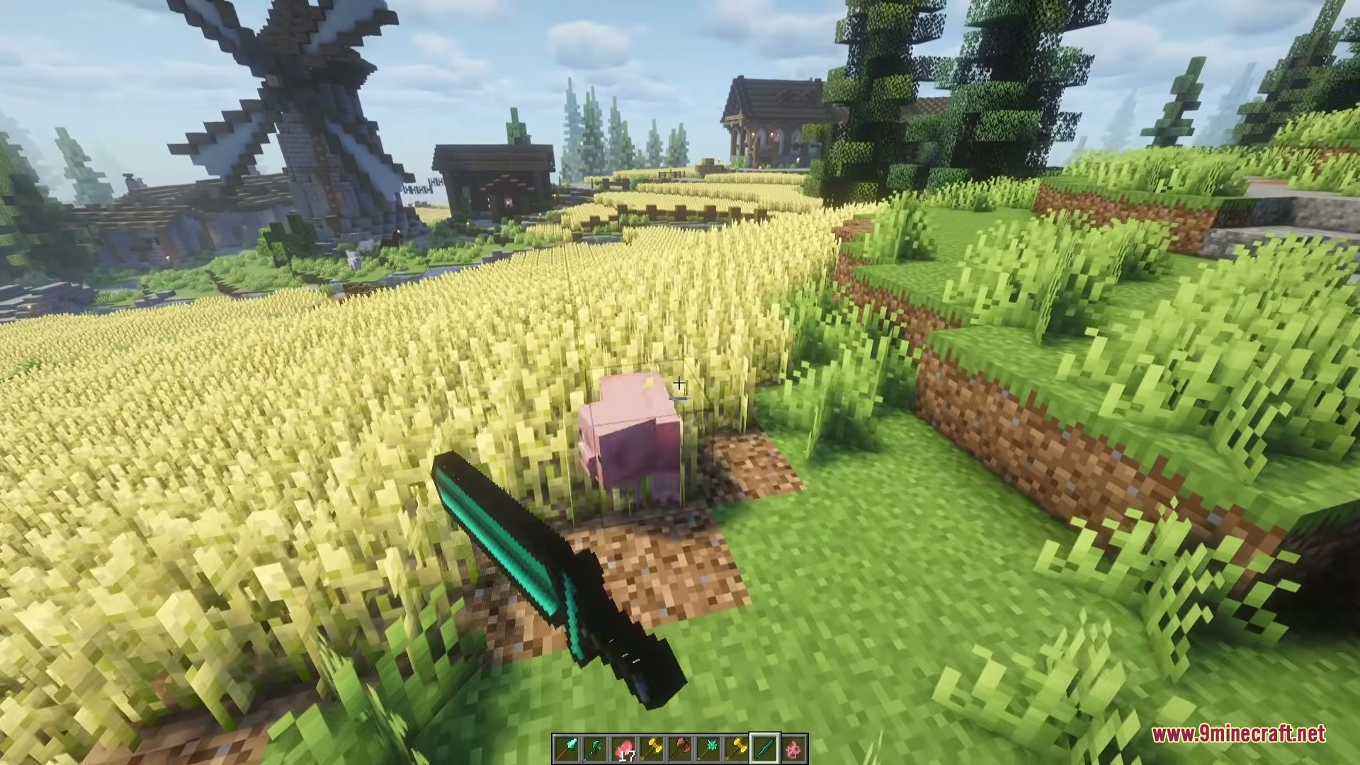 Vanilla Armory Mod Screenshot 10 Player holding a diamond greatsword in a wheat field with a windmill