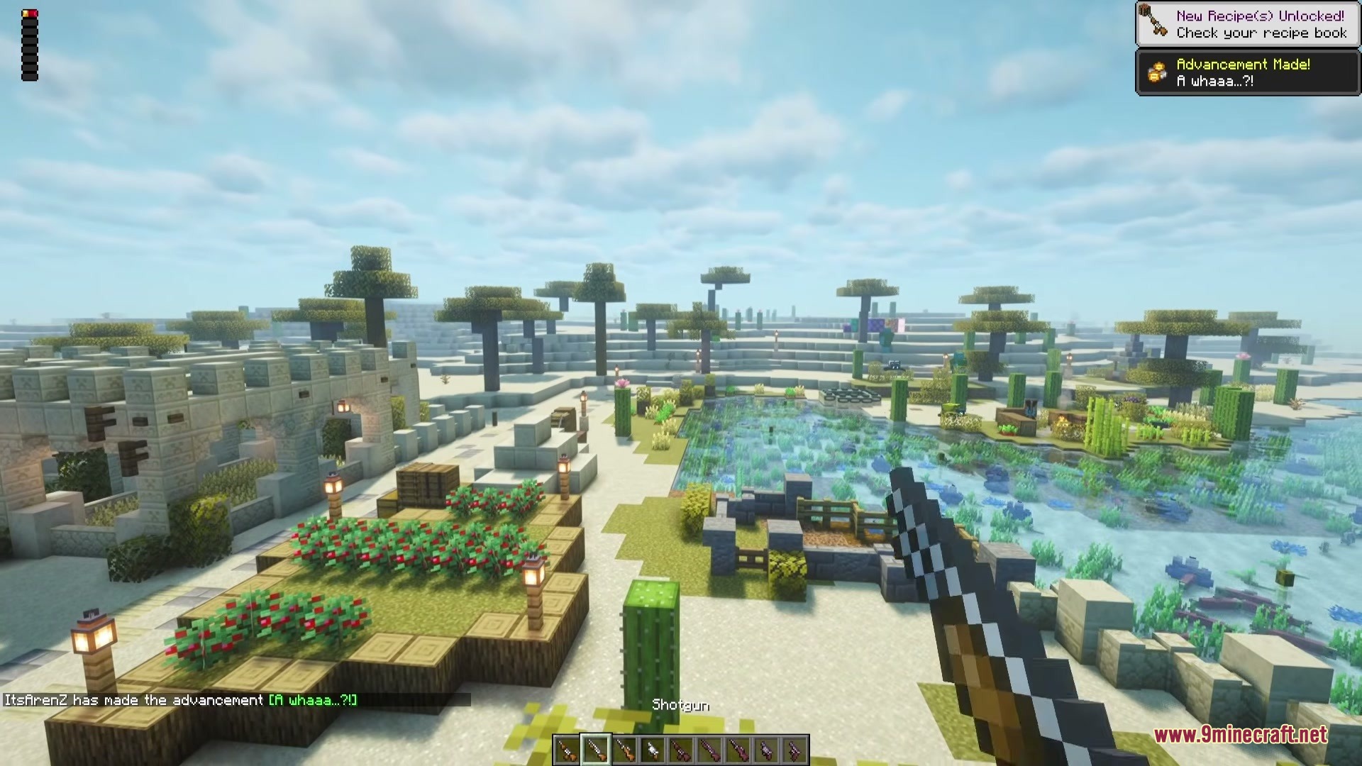 Vanilla Gun Mod Screenshot 2 The player holds a shotgun while exploring a scenic desert oasis biome