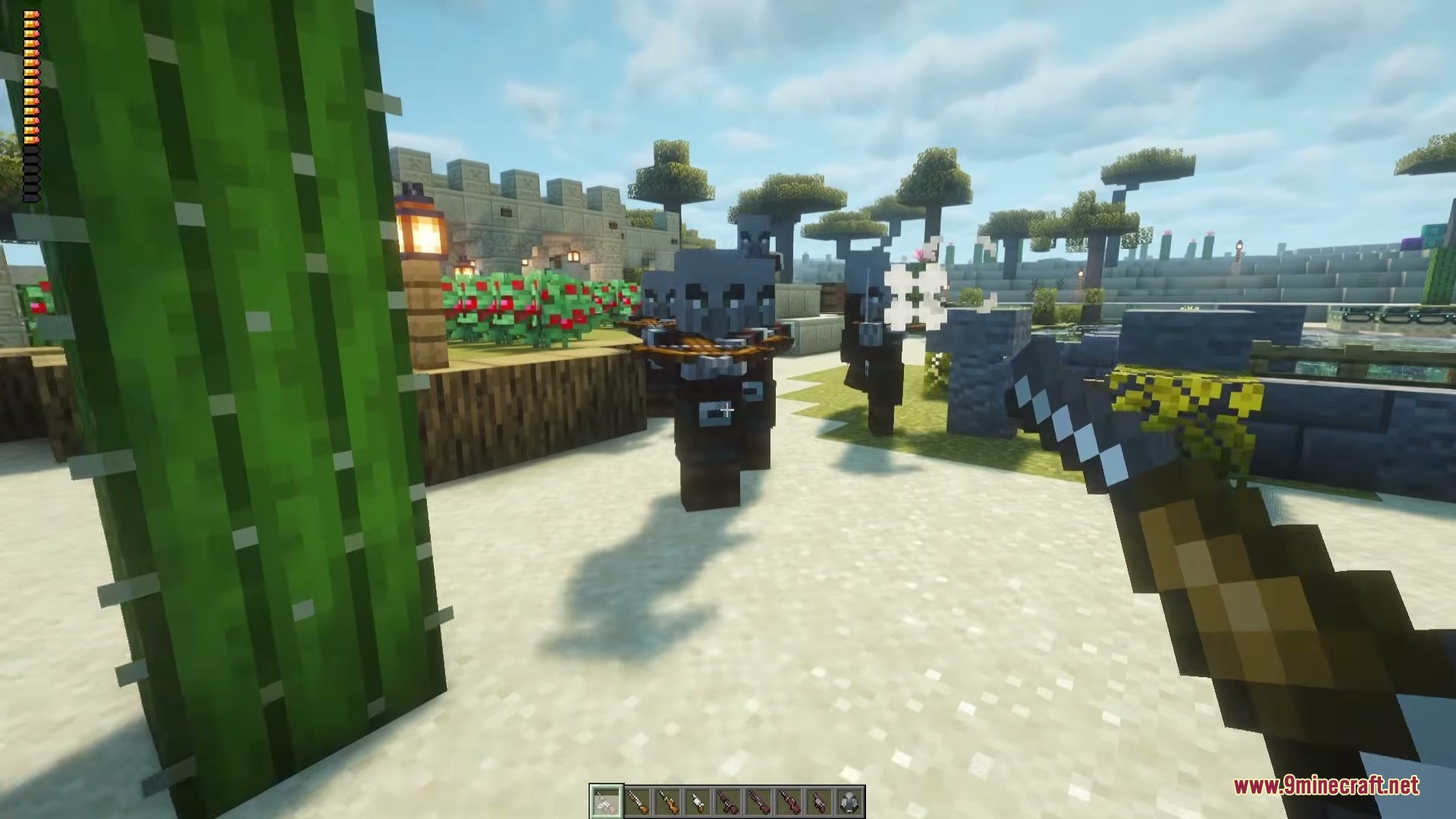 Vanilla Gun Mod Screenshot 5 A player aims a firearm at Pillagers near a large green cactus