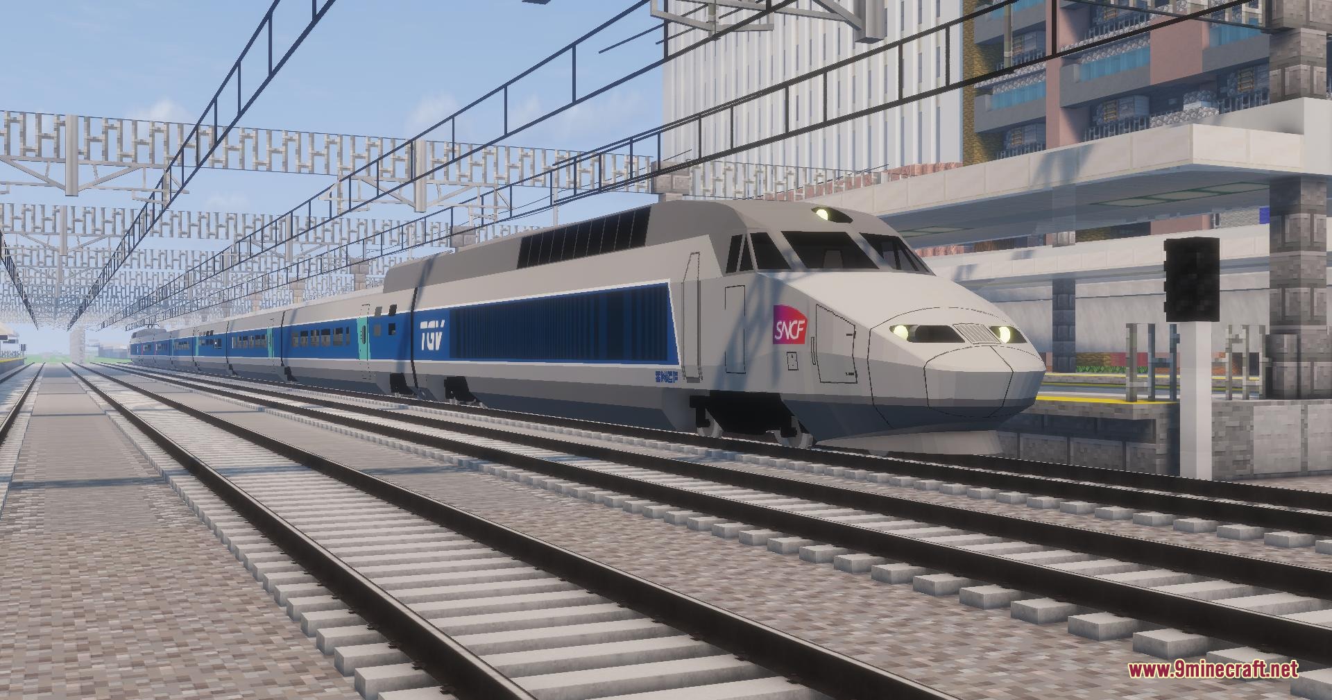 Velocity Rail Streamline Resource Pack Screenshot 1 A silver and blue French high speed train traveling on Minecraft tracks