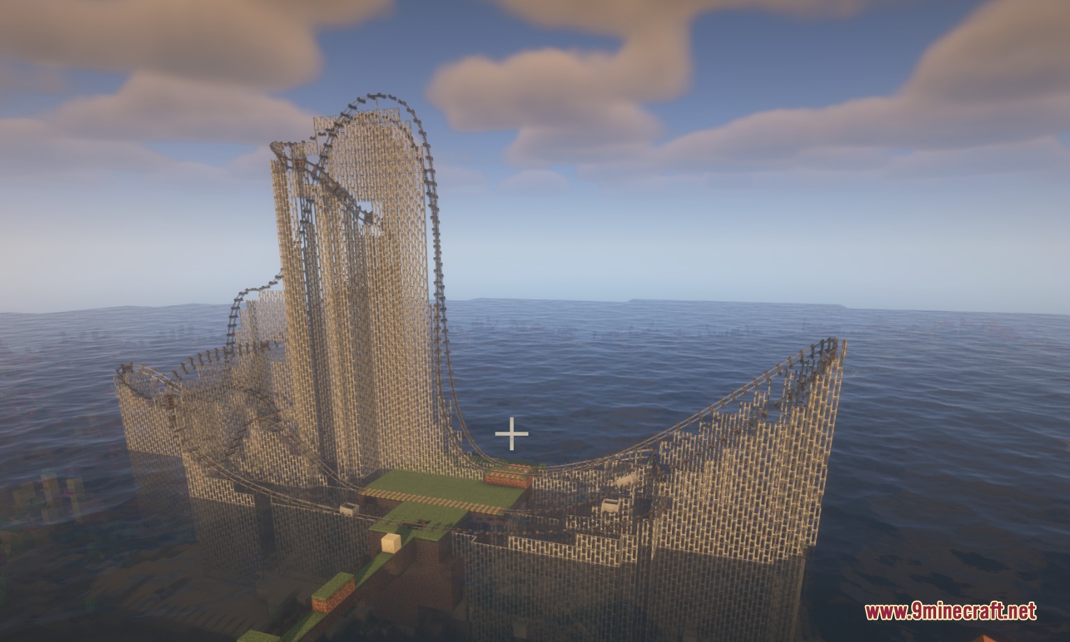 Large roller coaster with complex supports and curved rails over the open ocean