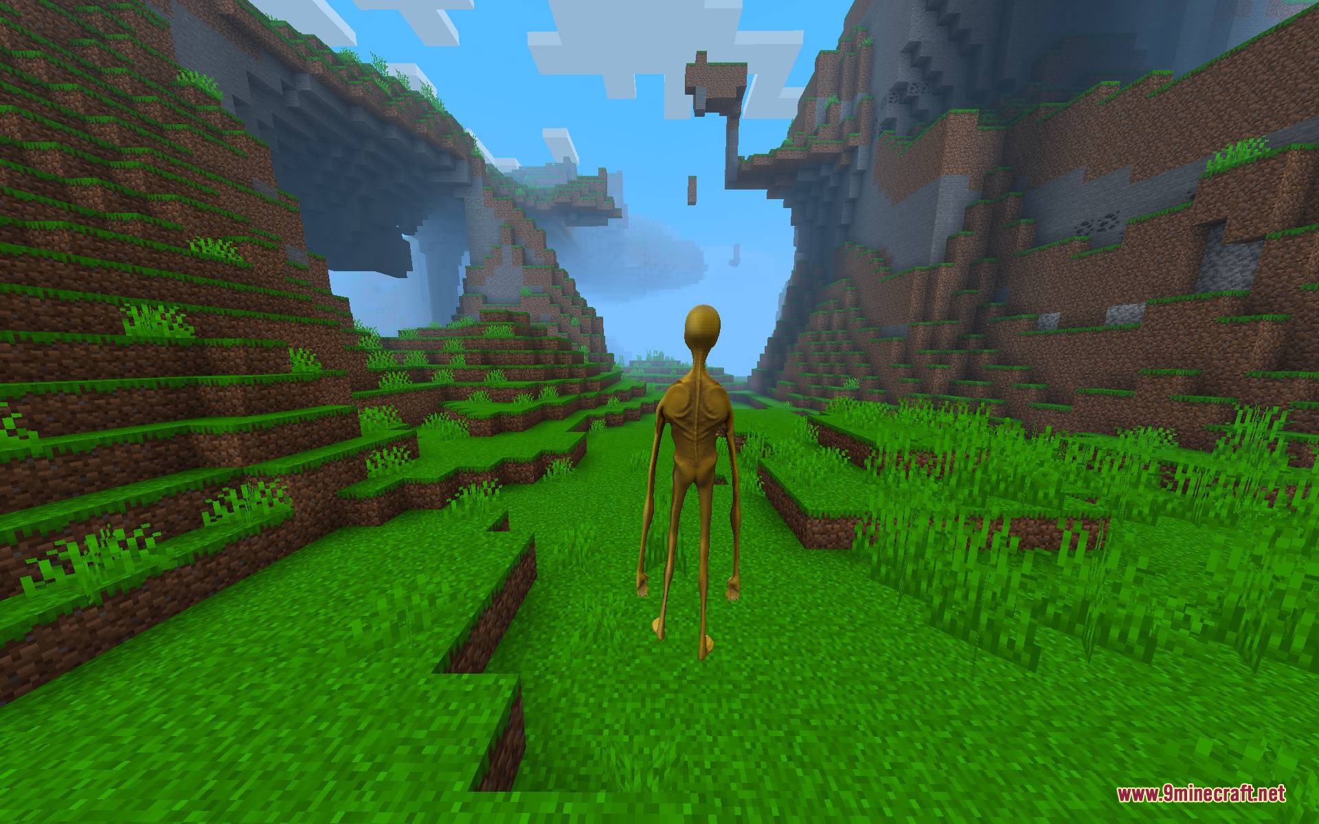 Verity Body Overhaul Mod Screenshot 7 A tall yellow Verity monster stands in a green Minecraft valley