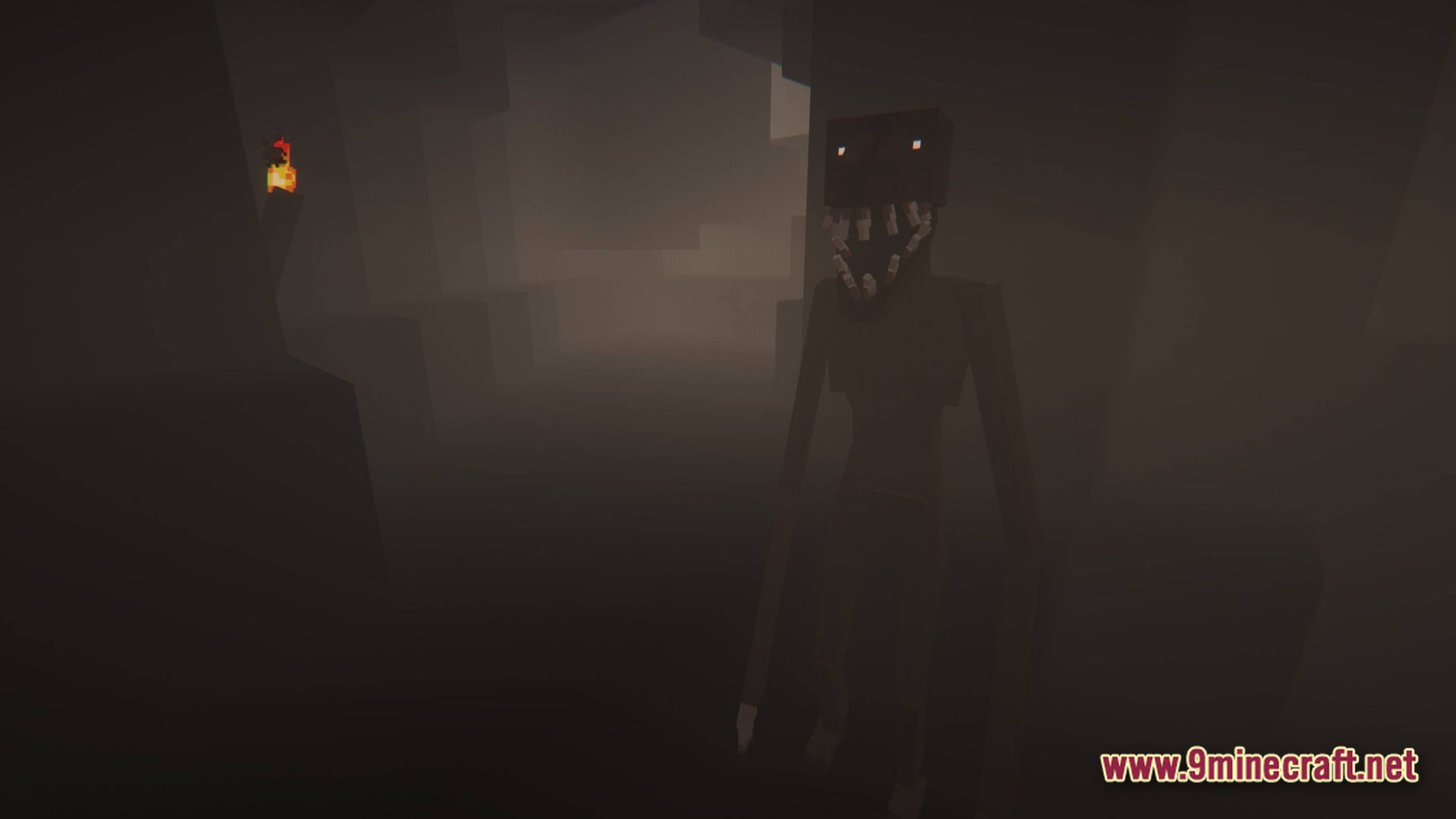 A tall, dark humanoid creature with glowing eyes and sharp teeth stands in a foggy cave