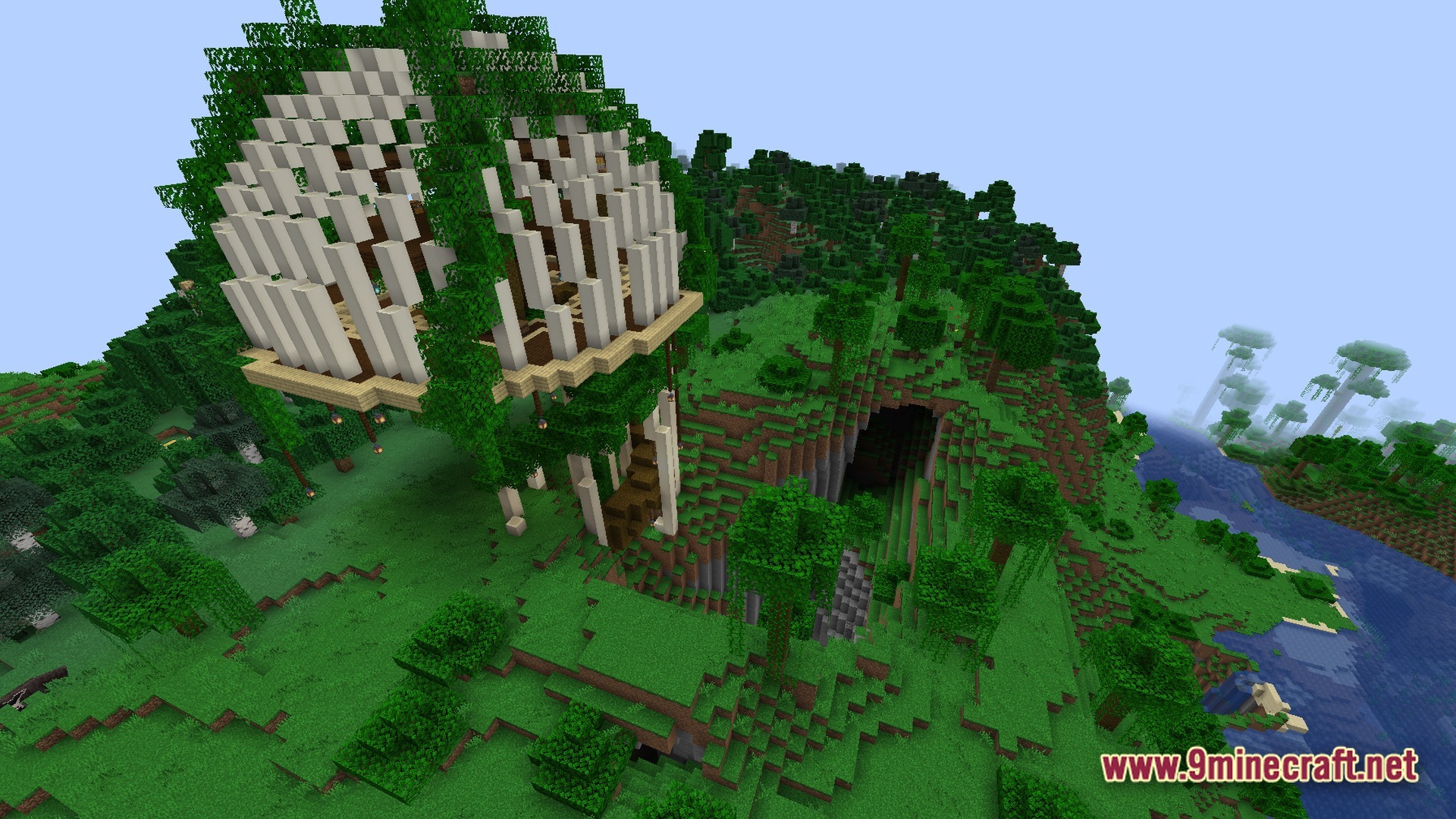 Verminous Kinetic Depths Modpack Screenshot 2 A large bone-ribbed structure covered in vines sits atop a forested hill overlooking a cave entrance