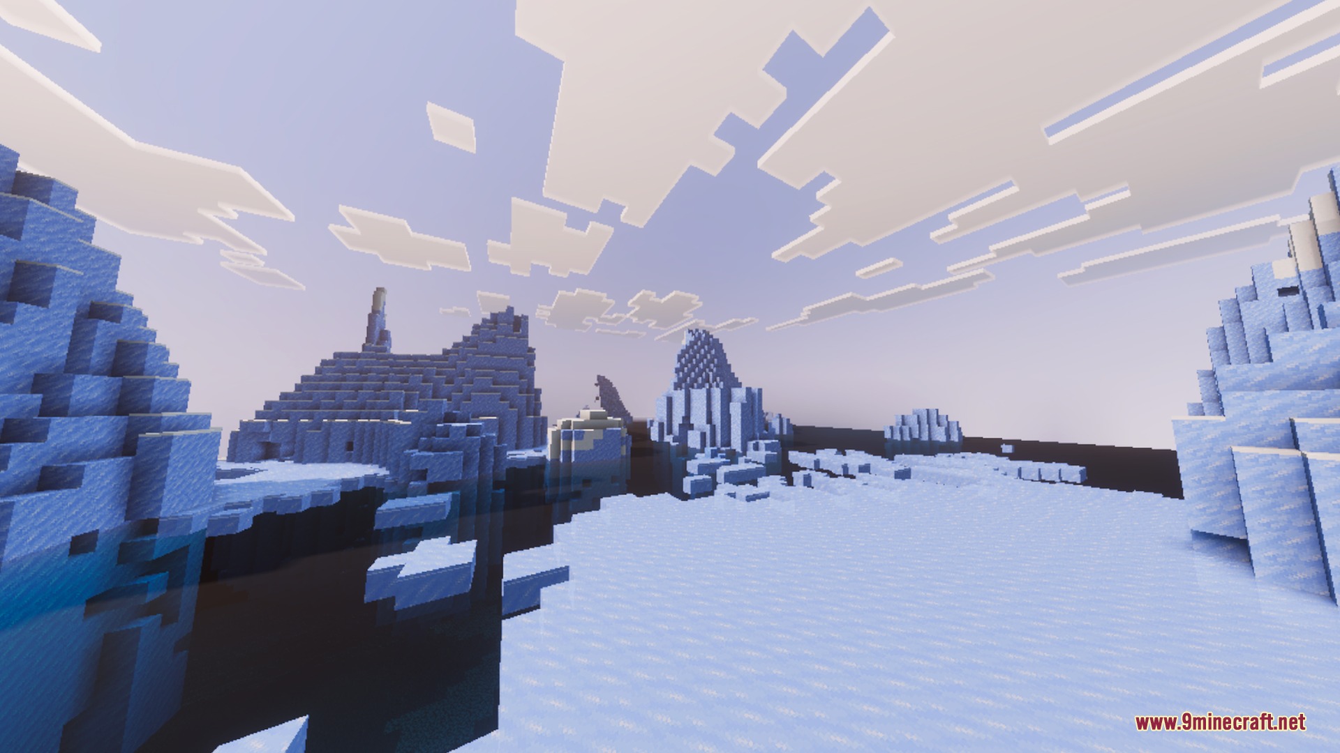 Soft fog surrounds towering ice spikes in a vast frozen Minecraft ocean biome