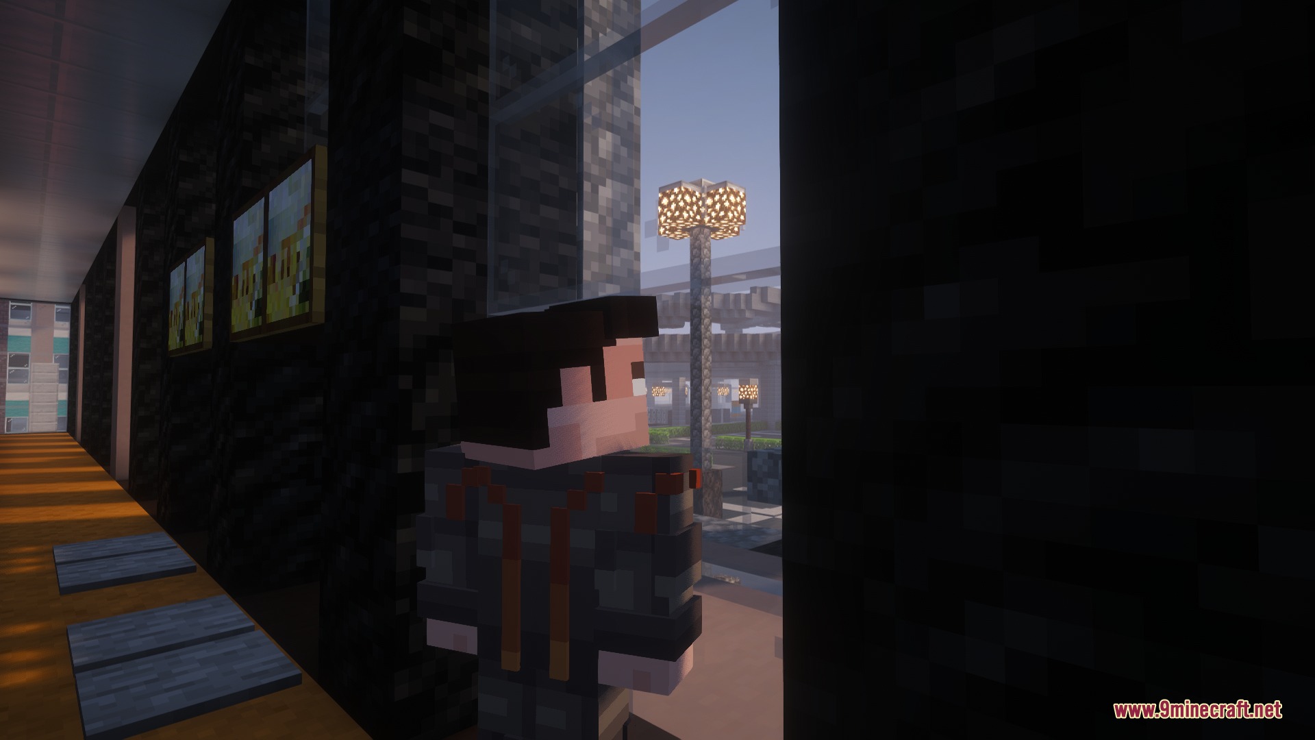 A player character stands inside a building looking out through a large window