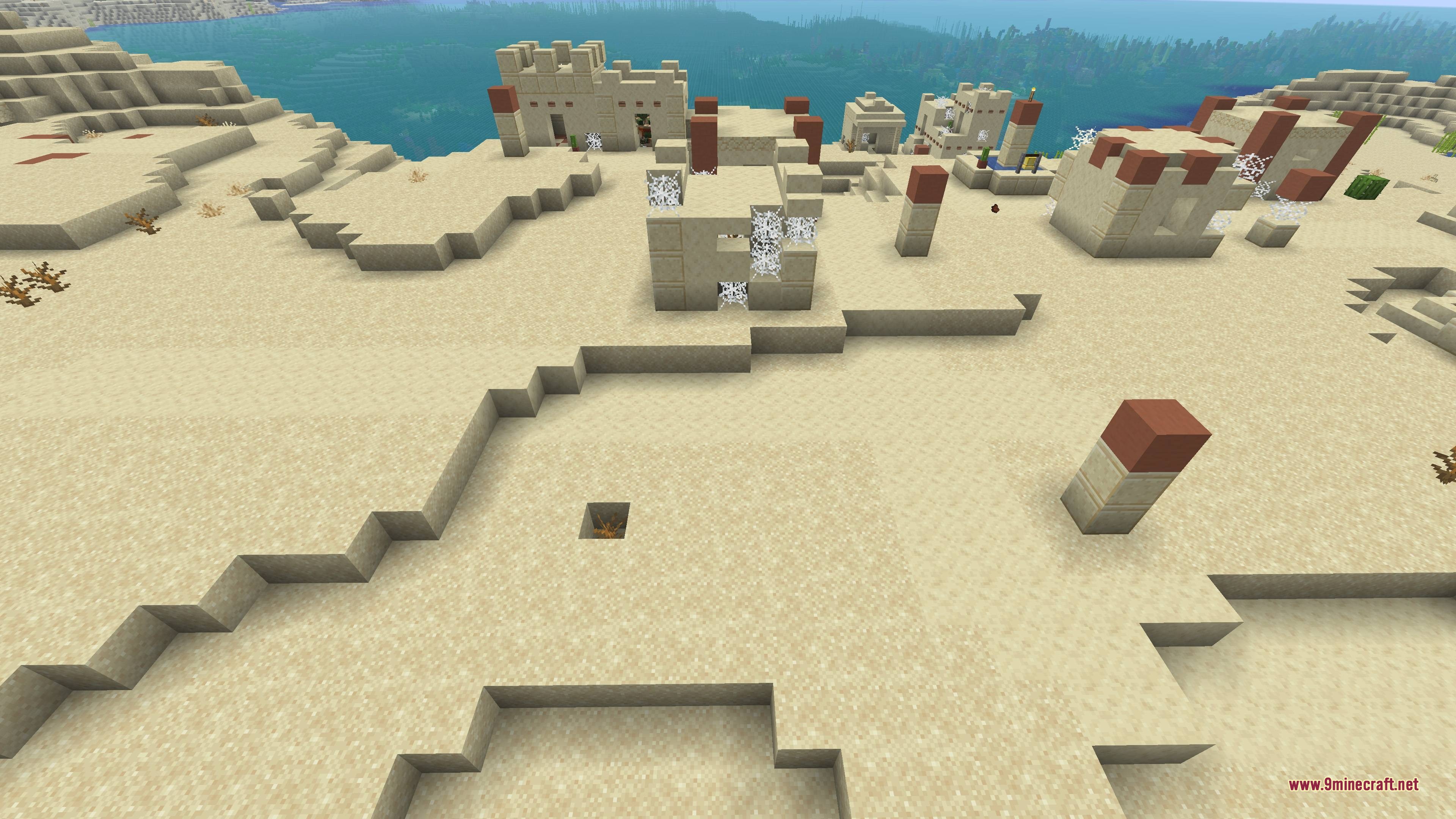 Abandoned desert village with cobwebs and crumbling sandstone buildings by the sea