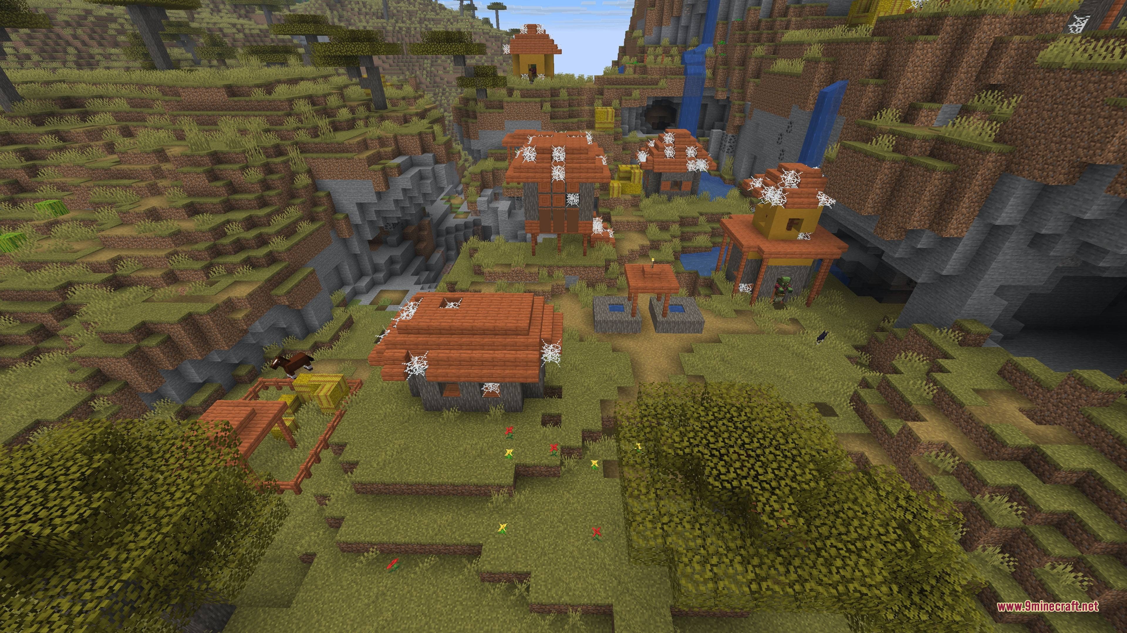 A zombie villager wanders through an abandoned savanna settlement covered in cobwebs