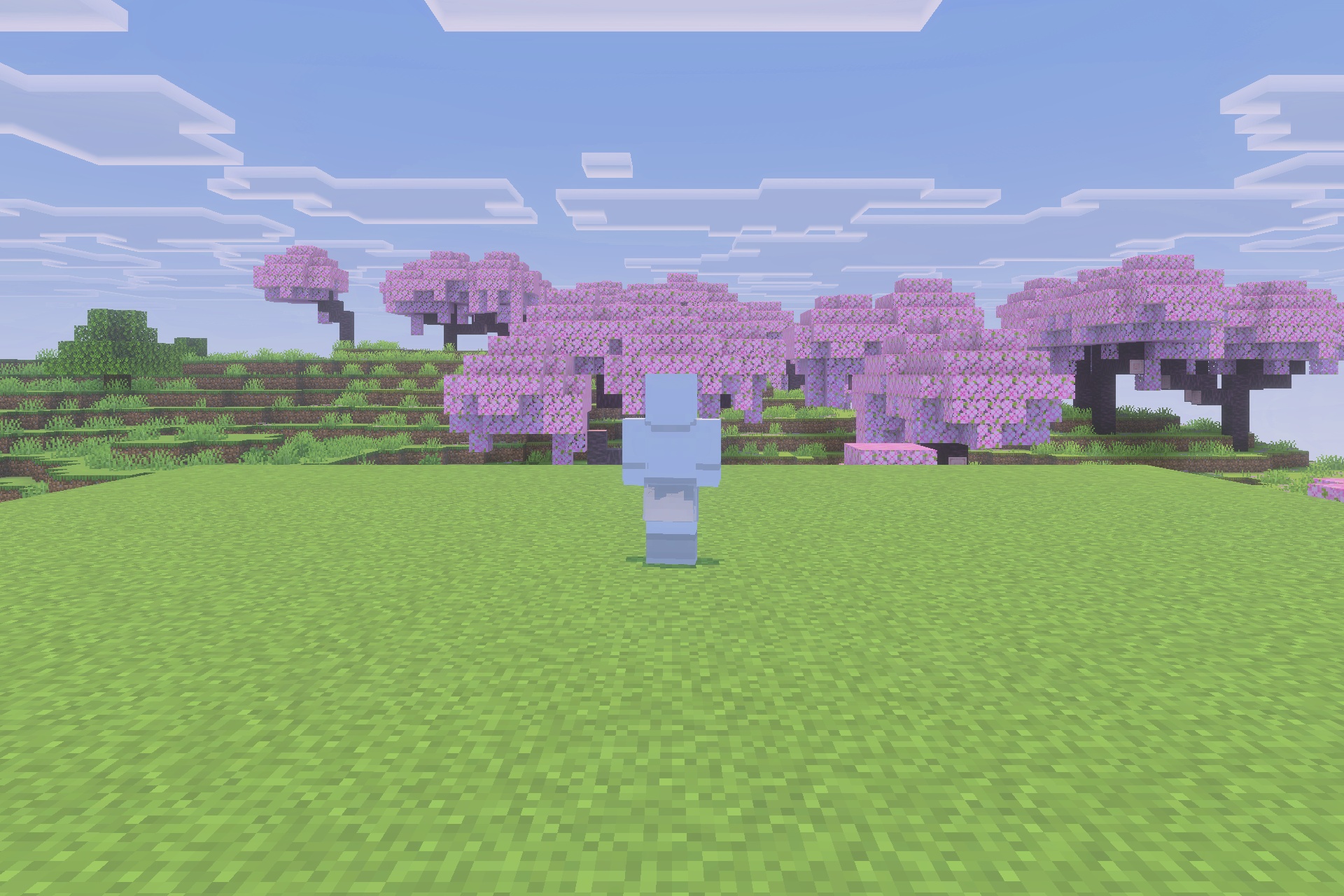 Viltrumite Addon Update Addon Screenshot 1 A transparent blue humanoid figure stands in a field of cherry blossom trees