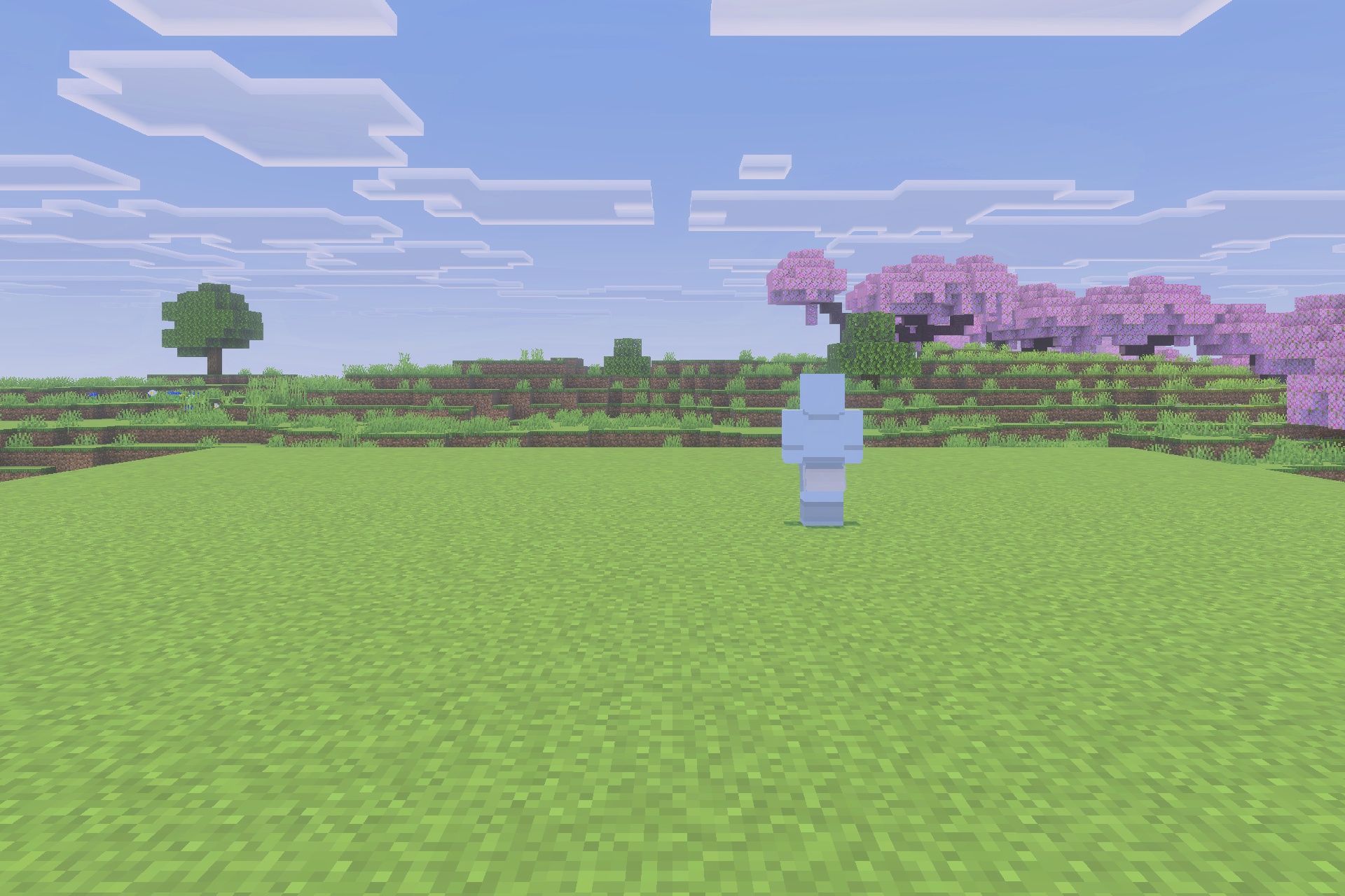 Viltrumite Addon Update Addon Screenshot 2 The transparent blue character model stands on a grassy field near pink trees