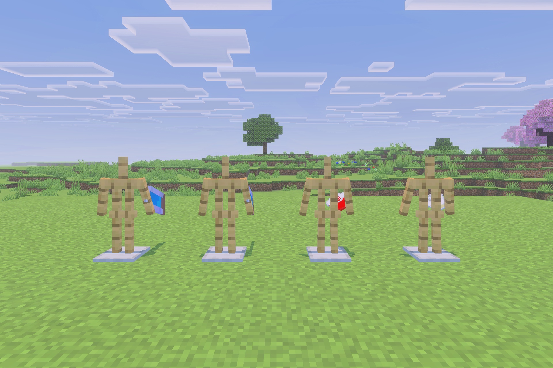 Viltrumite Addon Update Addon Screenshot 4 Four armor stands displaying various character suits and capes on the grass