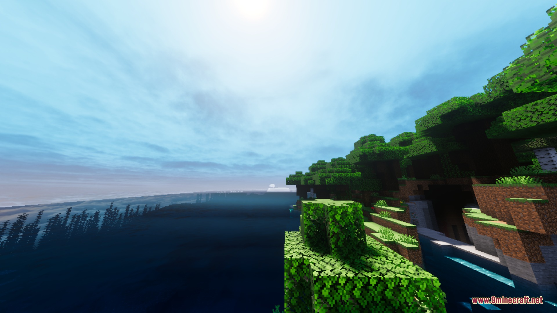 Visuals PLUS Shader Screenshot 1 Realistic sunlight shines over a lush coastal forest and deep blue ocean water