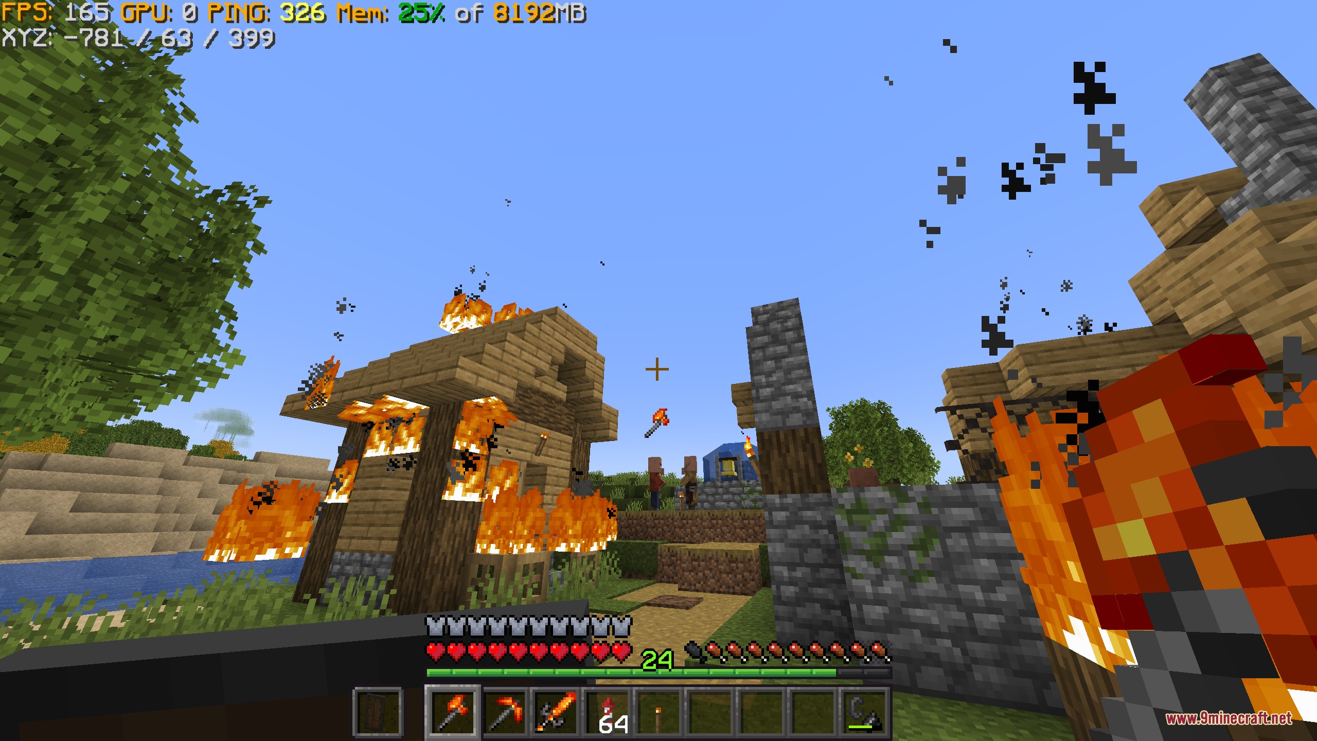 Vivid Interface Designer Mod Screenshot 4 Player holding a torch near burning houses with custom interface data visible