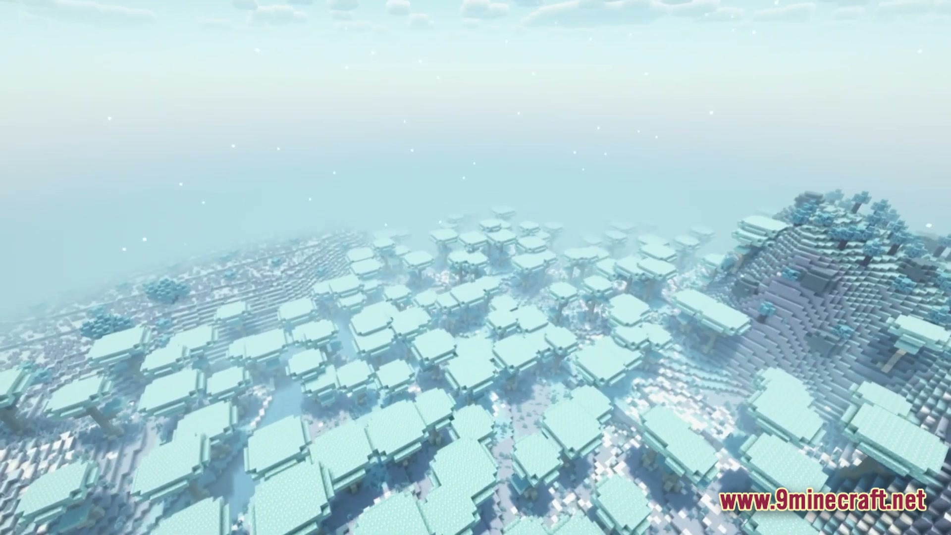 Vivid Kinetic Ether Modpack Screenshot 3 A vast forest of flat-topped, light blue trees under a hazy, pale sky in a snowy biome