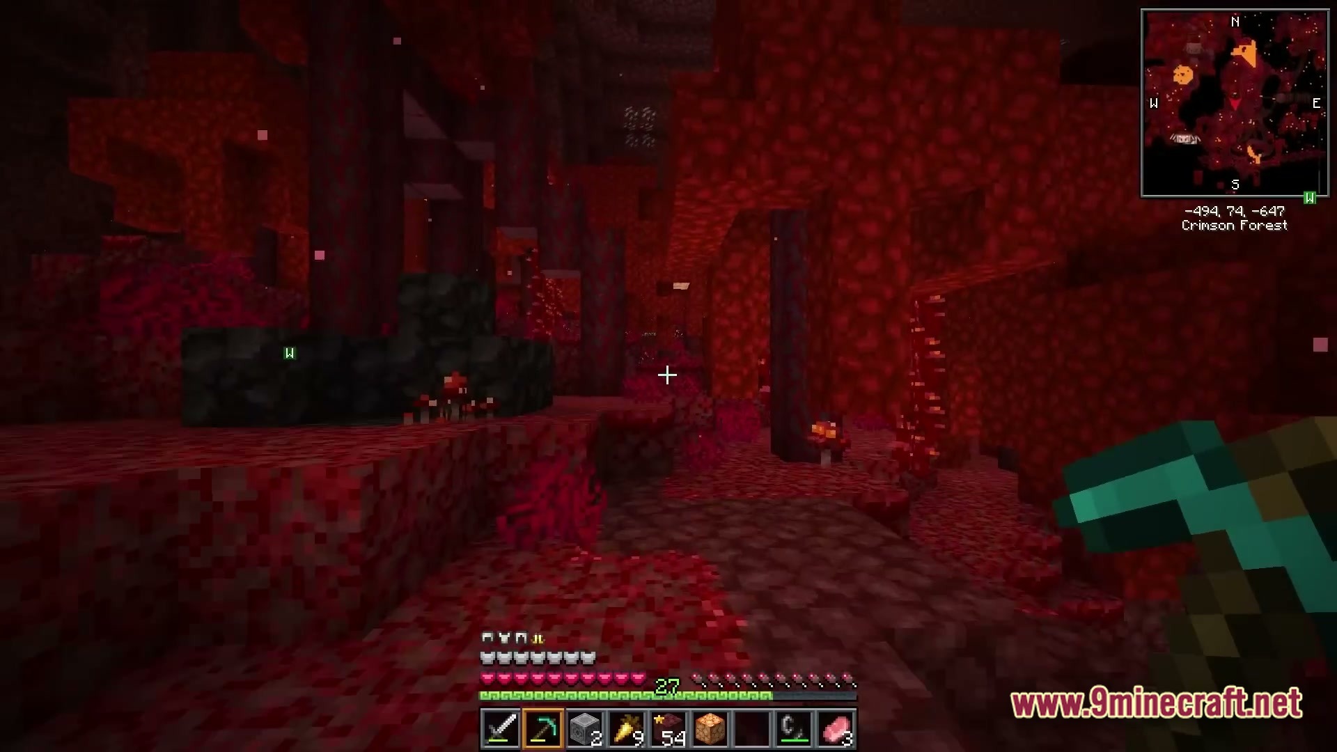 Vividia Horizon Modpack Screenshot 1 A player explores a Crimson Forest biome in the Nether while holding a diamond pickaxe