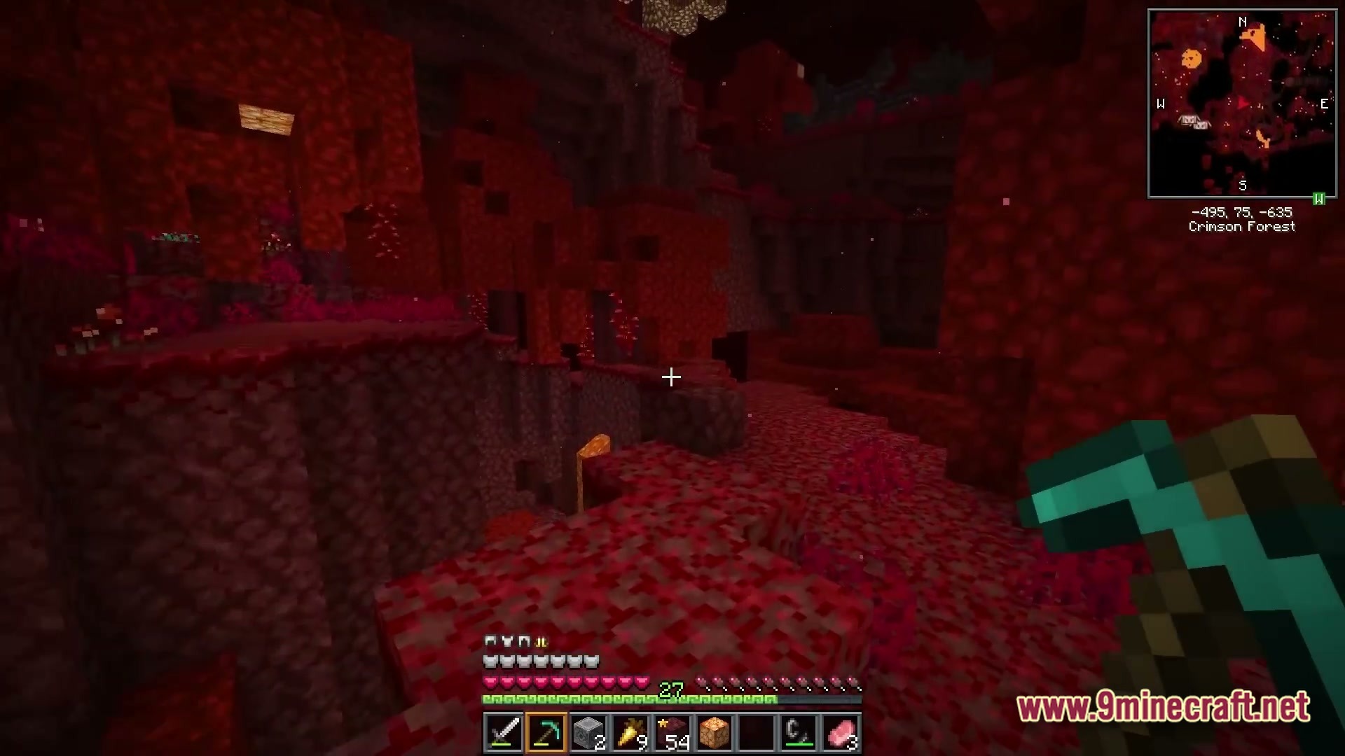 Vividia Horizon Modpack Screenshot 2 A player explores a Crimson Forest biome in the Nether while holding a diamond pickaxe