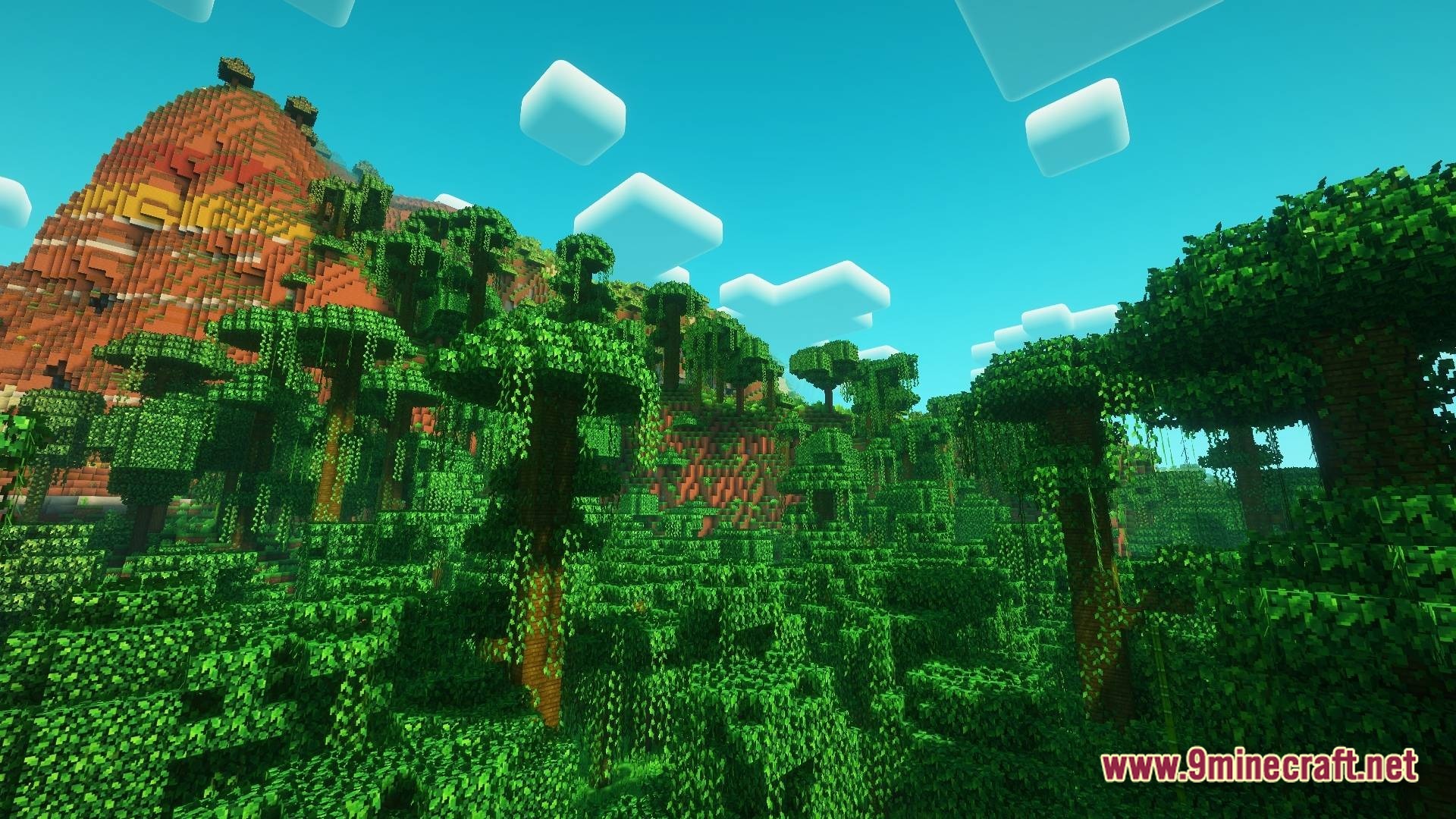 Vividia Horizon Modpack Screenshot 8 Dense jungle trees with hanging vines grow at the base of a large terracotta mountain