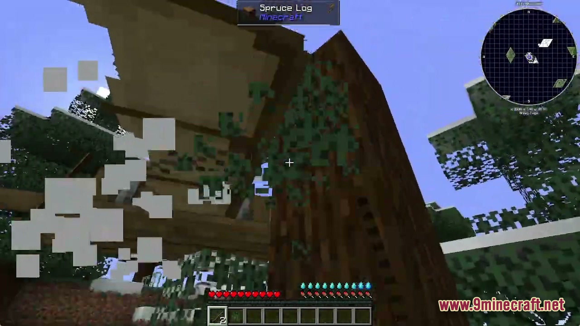 Voidlock Genesis Overdrive Modpack Screenshot 1 A player harvests a spruce log from a tree in a snowy taiga biome