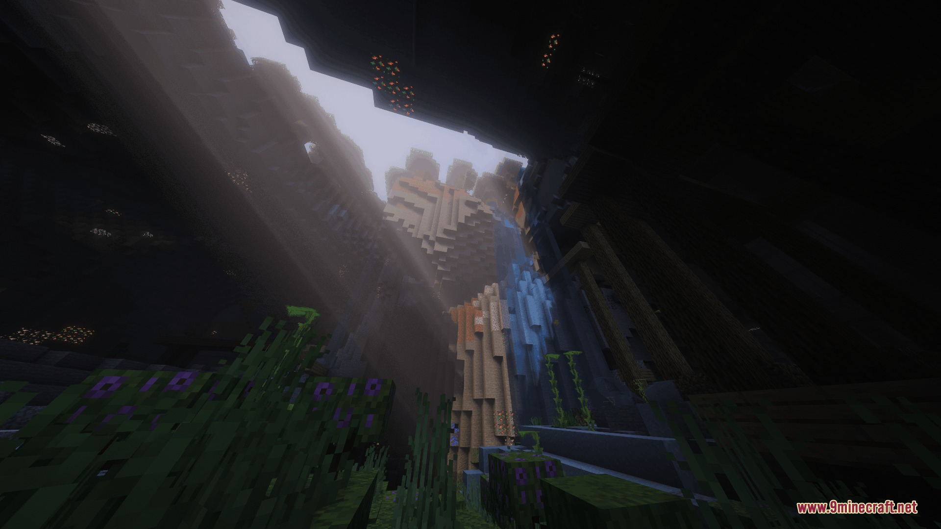 Vulkanic Light Engine Mod Screenshot 8 Sunlight rays shining into a deep underground cave through a large ceiling opening