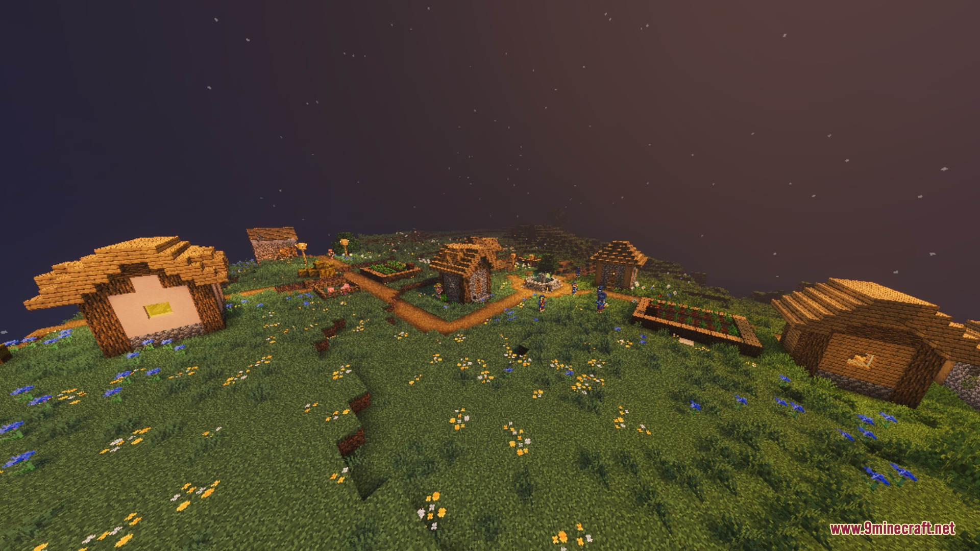A peaceful village settlement on a grassy hill under a starry sky
