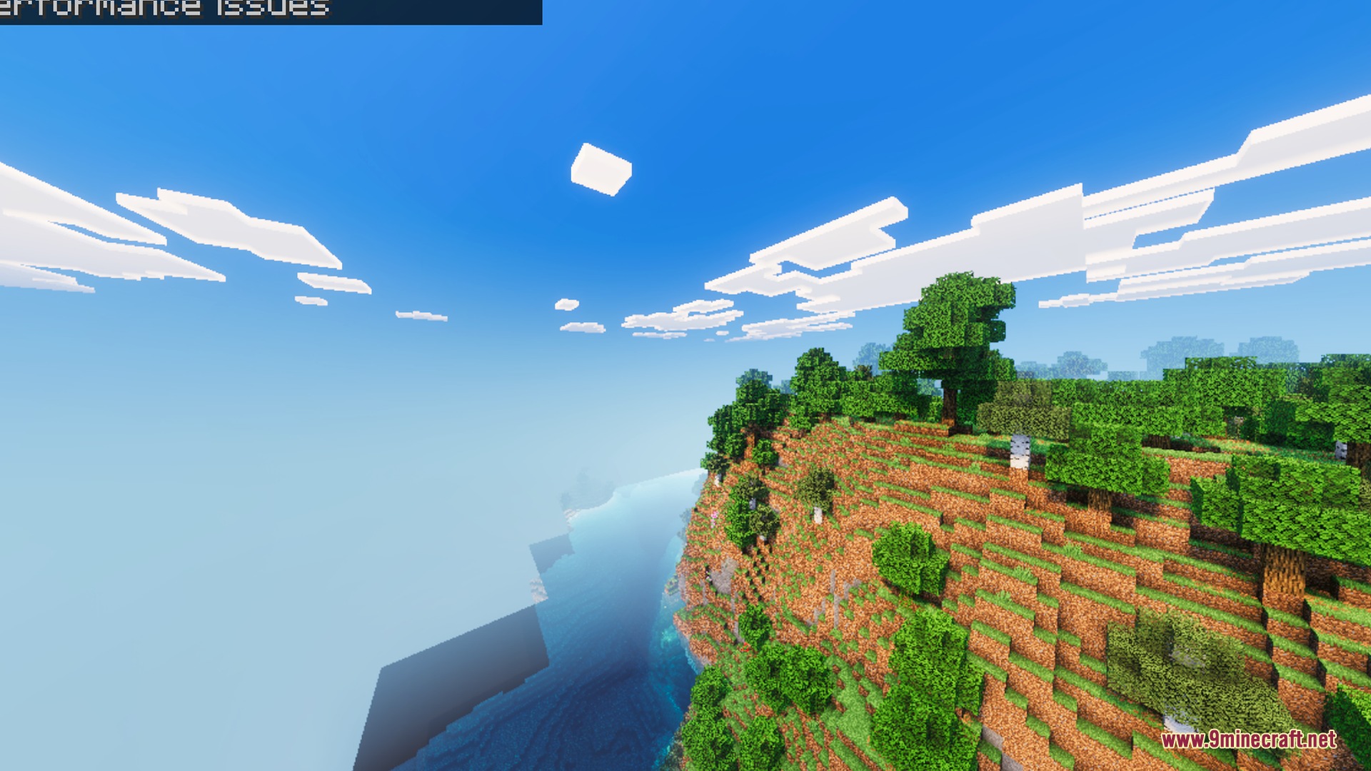 Lush green trees on a cliffside overlooking realistic water and soft clouds