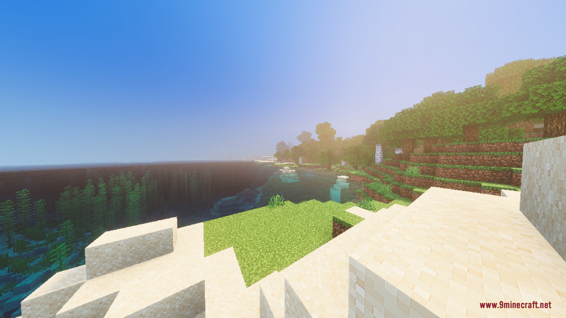 Sun drenched beach landscape with soft volumetric sunbeams and vibrant green grass