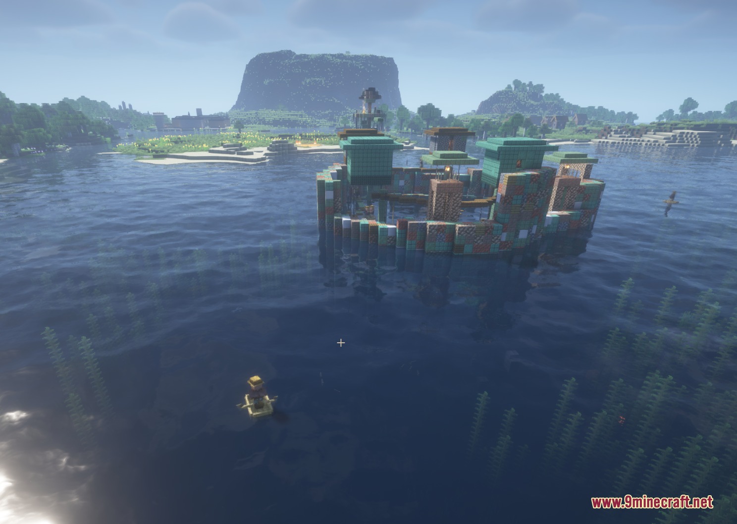 Water World Atolls Mod Screenshot 6 Fortified ocean base with wooden walkways and huts near a large distant mountain