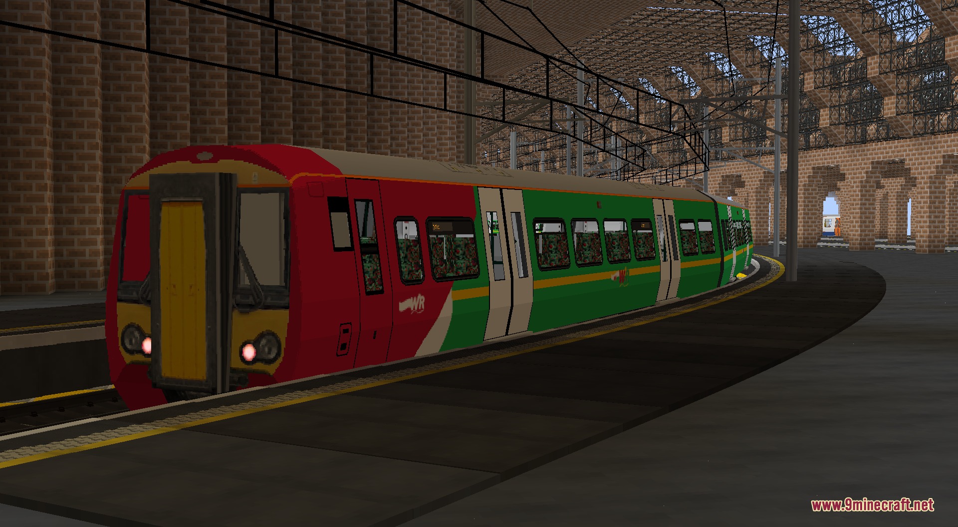 Welshie Rail Resource Pack Screenshot 1 A red and green WelshieRail train stopped at a large brick station platform