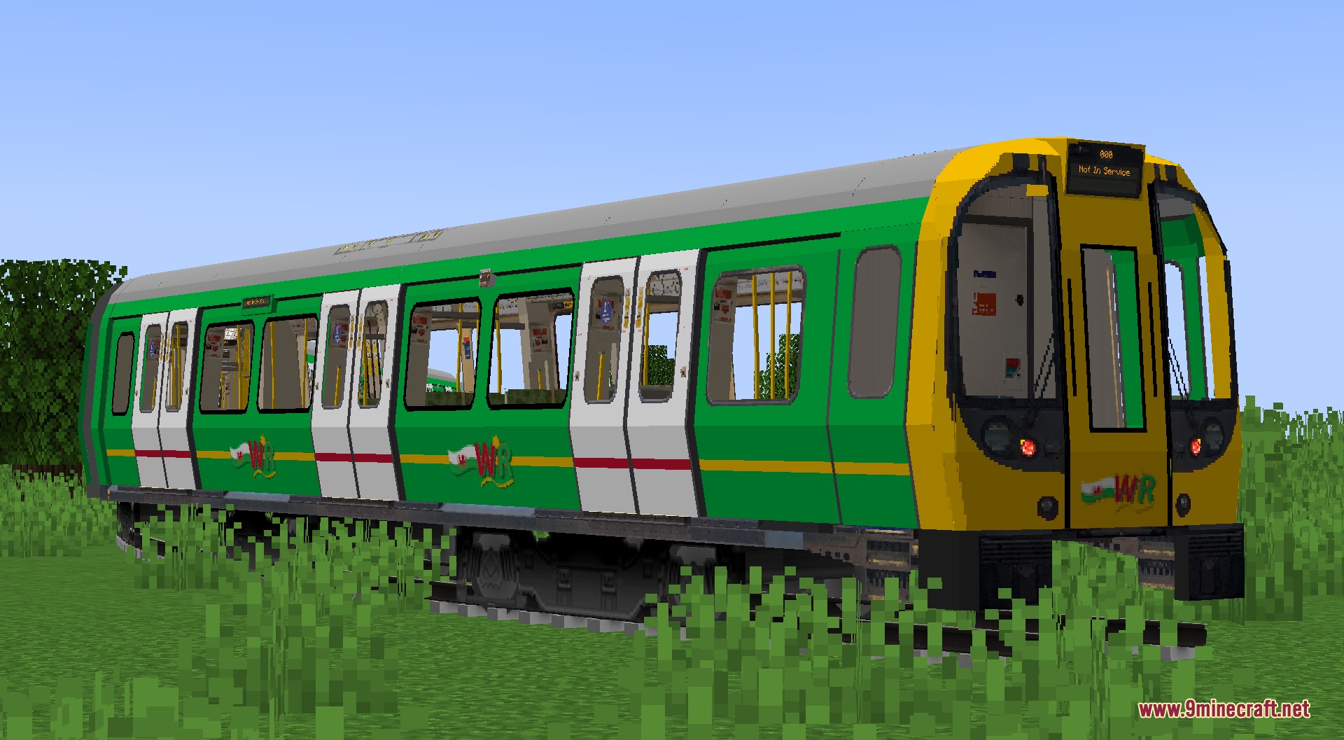 Welshie Rail Resource Pack Screenshot 7 A green and yellow train sits on tracks in a grassy field