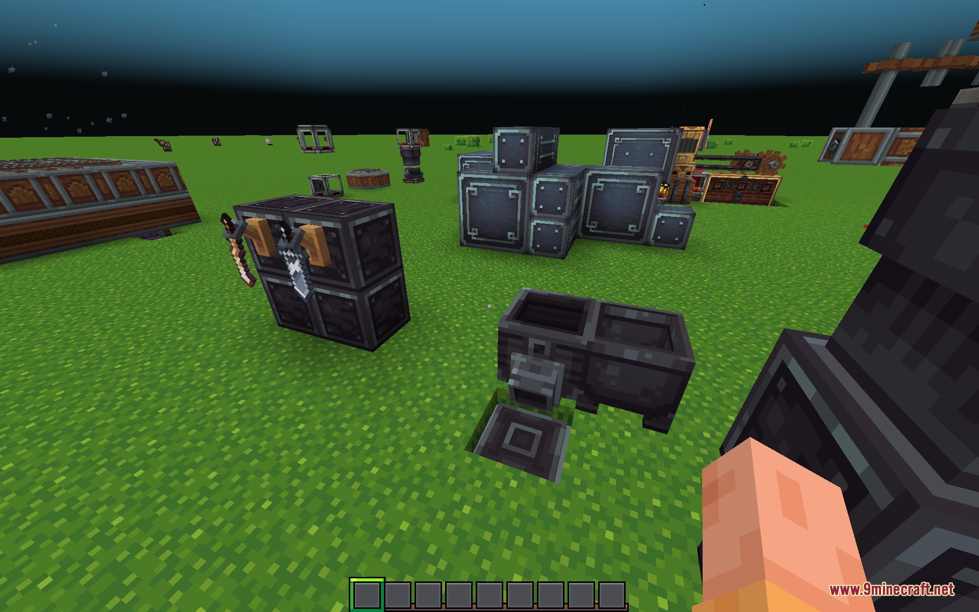 Whimscape X Create Resource Pack Screenshot 3 Dark metal industrial blocks and tool displays arranged on a grass field