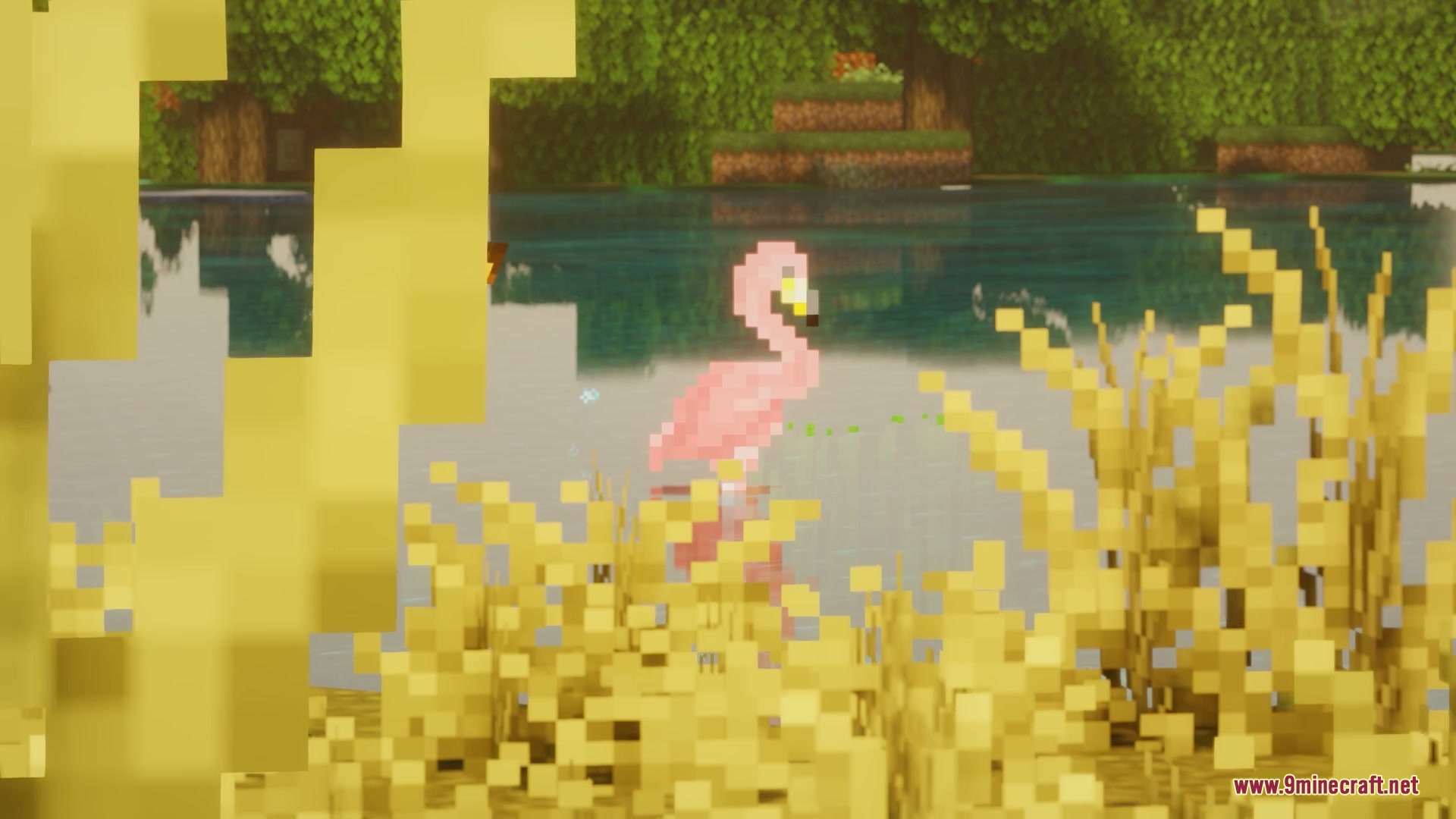 Wildwood Echoes Mod Screenshot 4 A pink flamingo stands in shallow water surrounded by tall yellow reeds