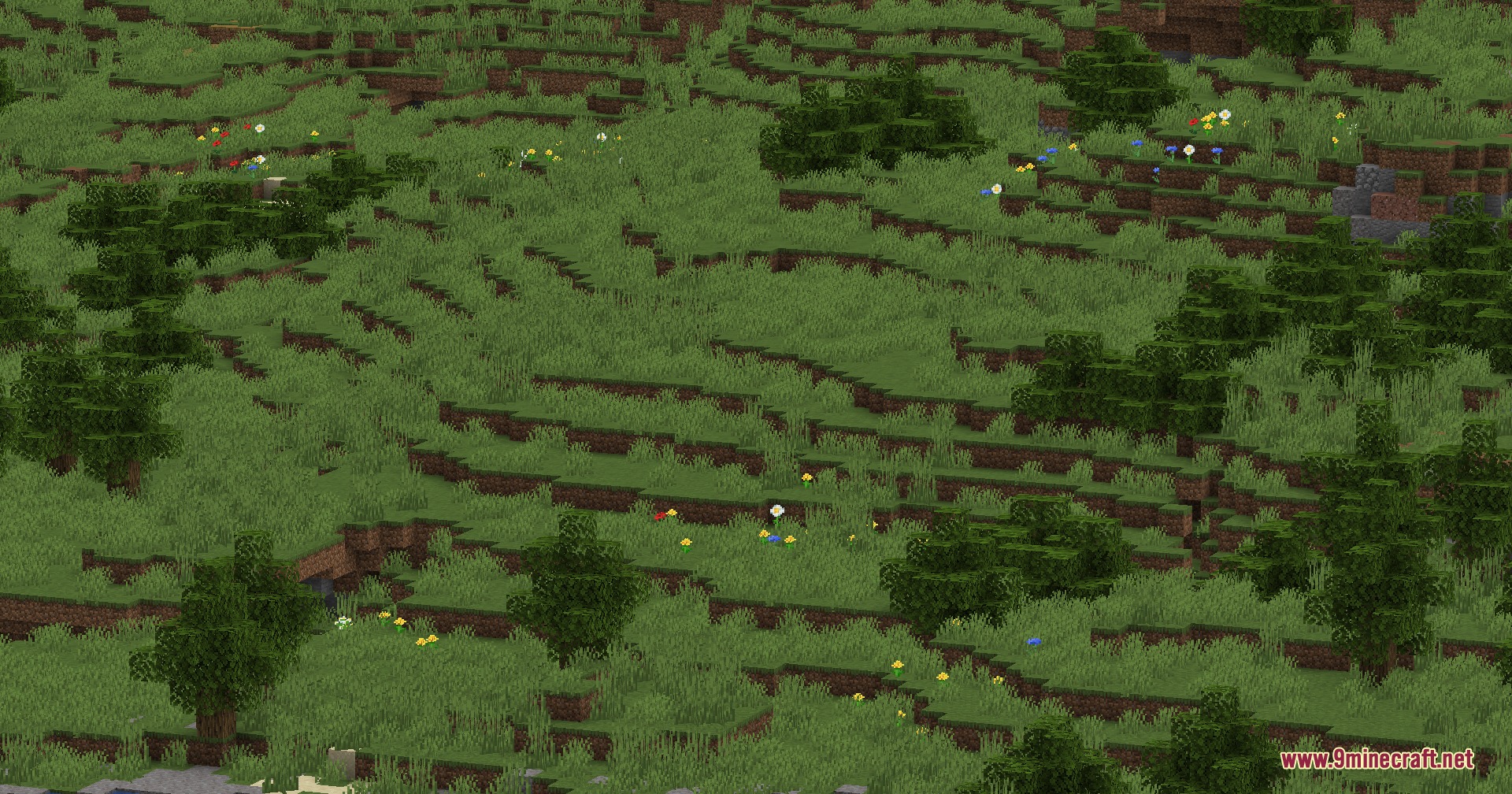 Wildwood Topography Mod Screenshot 1 Wildwood Topography Mod adds colorful flowers and bushes to a rolling green hillside