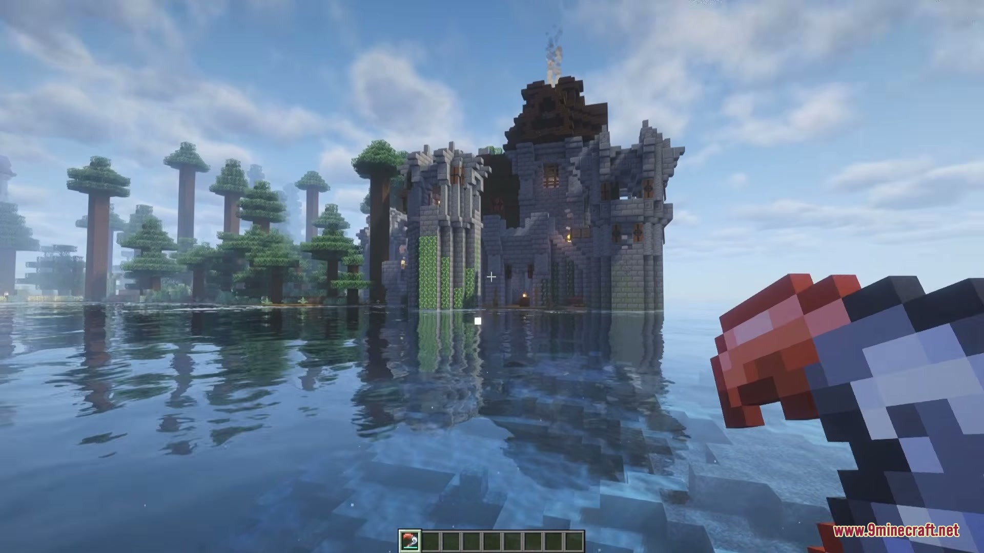 Wind Boomerang Mod Screenshot 1 A player holds a wind boomerang while looking at a stone castle