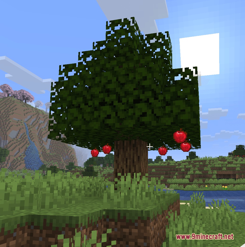 Winnetrie's Expansion Mod Screenshot 1 A wild apple tree with harvestable fruit growing in a Minecraft landscape