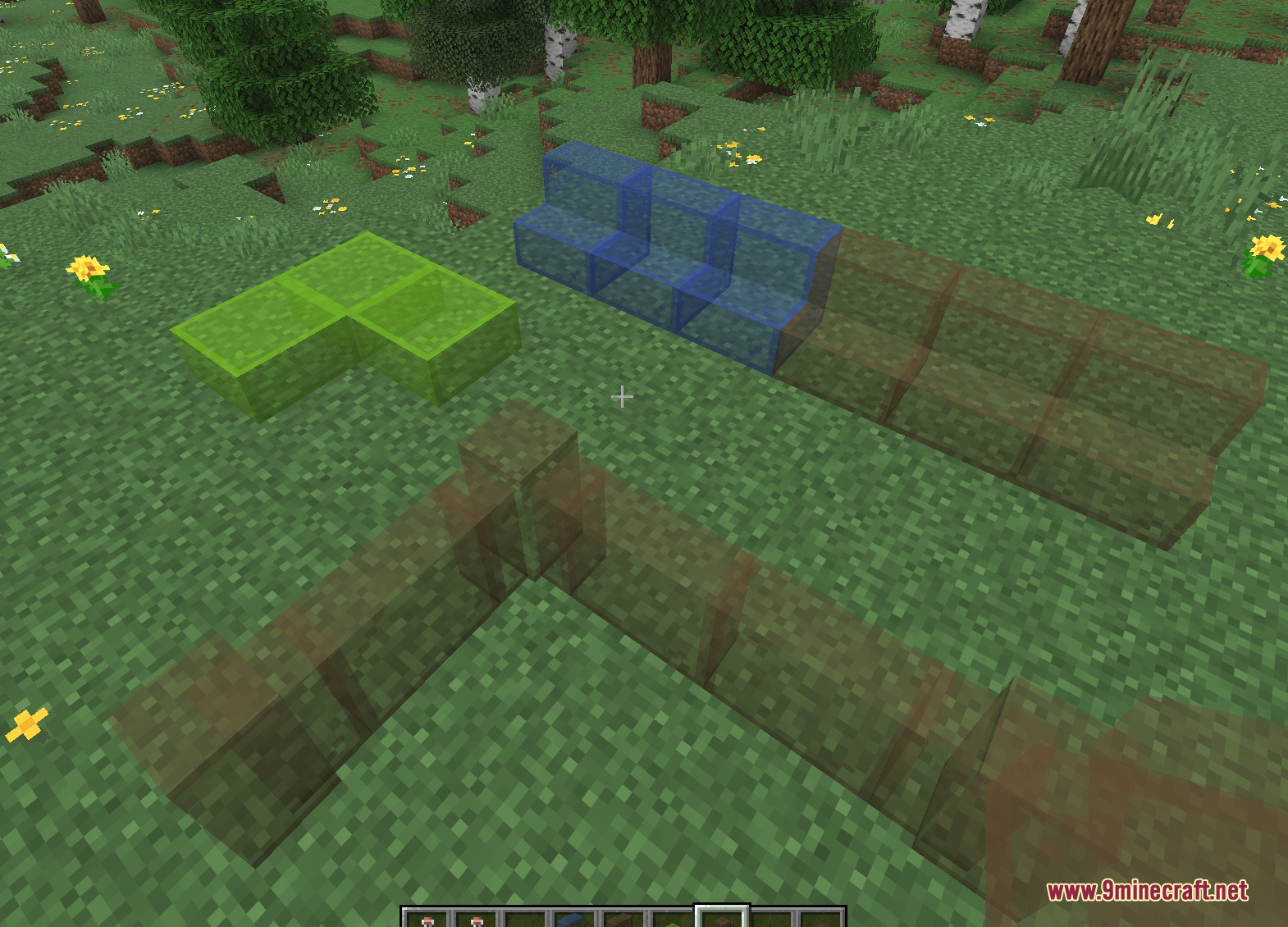 Winnetrie's Expansion Mod Screenshot 2 Colorful stained glass stairs and slabs placed on the grass in Minecraft