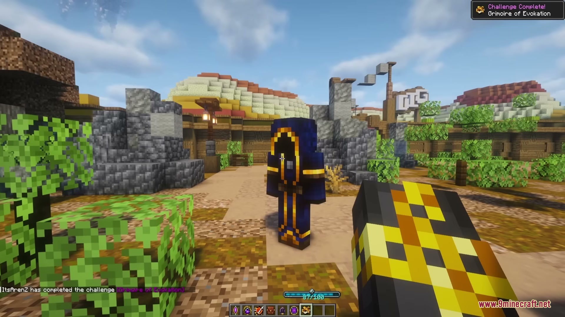 Wizard Companion Iron's Spells 'n Spellbooks Addon Mod Screenshot 2 A player stands near a wizard companion wearing a dark blue robe