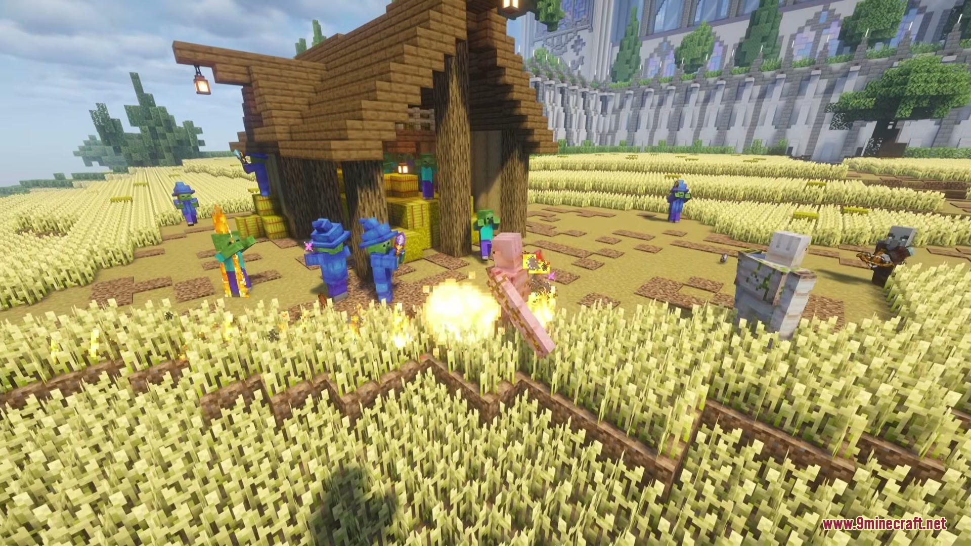 Wizard Mobs Mod Screenshot 5 Wizard zombies casting fire spells at an iron golem in a wheat field