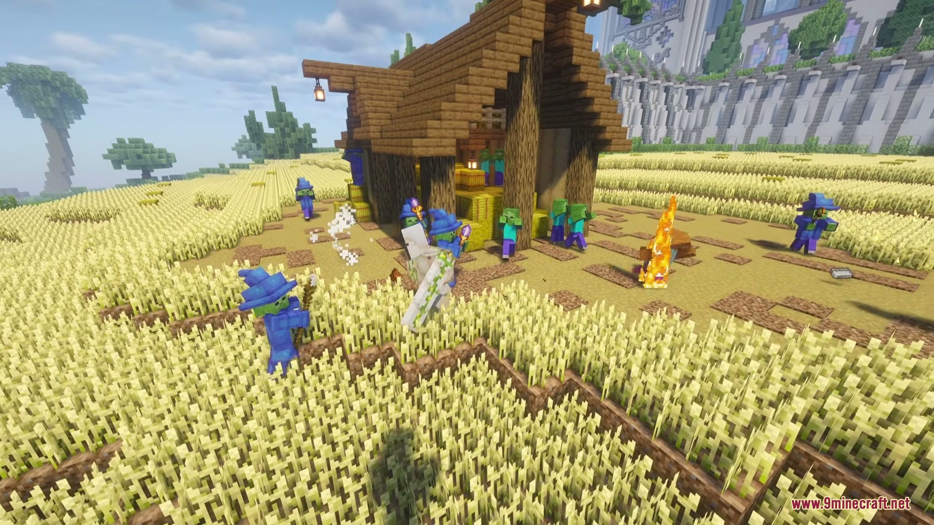 Wizard Mobs Mod Screenshot 6 Wizard zombies wearing blue robes and hats gathered around a wooden house