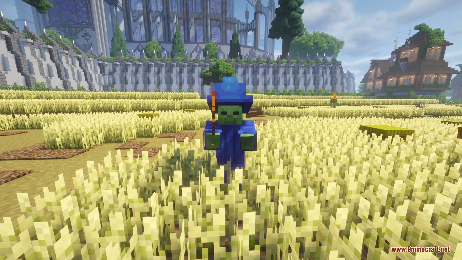 Wizard Mobs Mod Screenshot 7 A zombie wearing blue wizard robes and holding a magic wand in a field